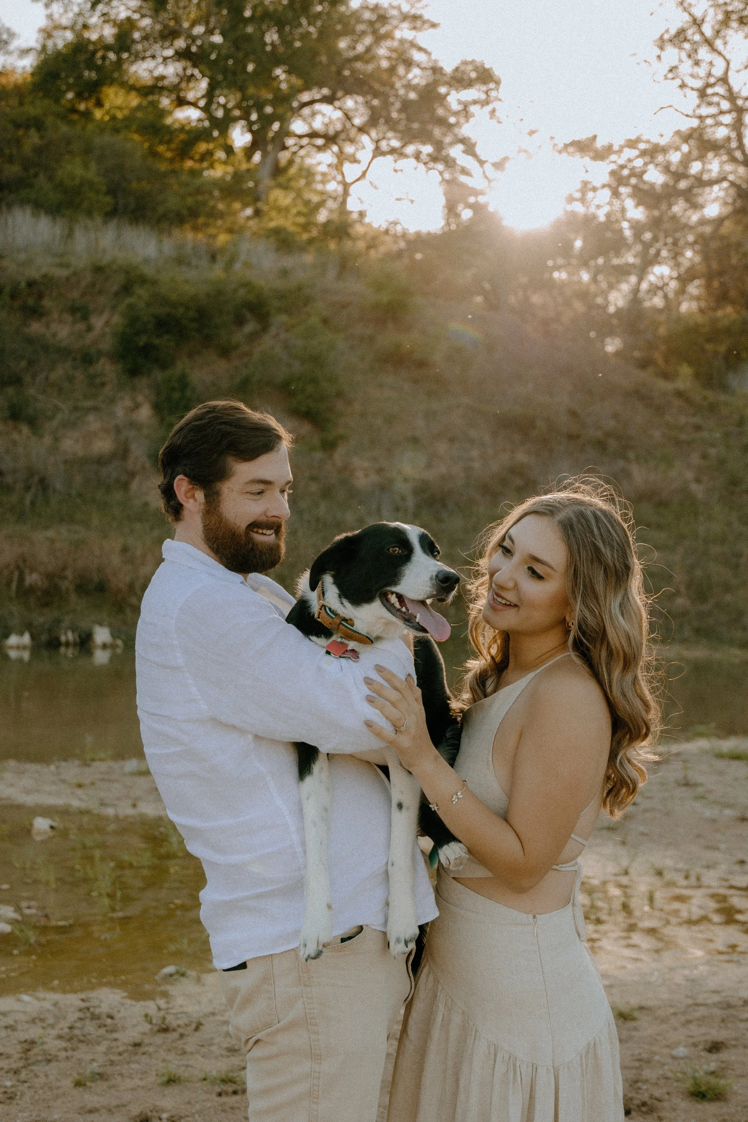 Houston & Texas Family, Couples, Newborn, Maternity, Bridal Photography – Dog being held by couple at golden hour in Austin TX.