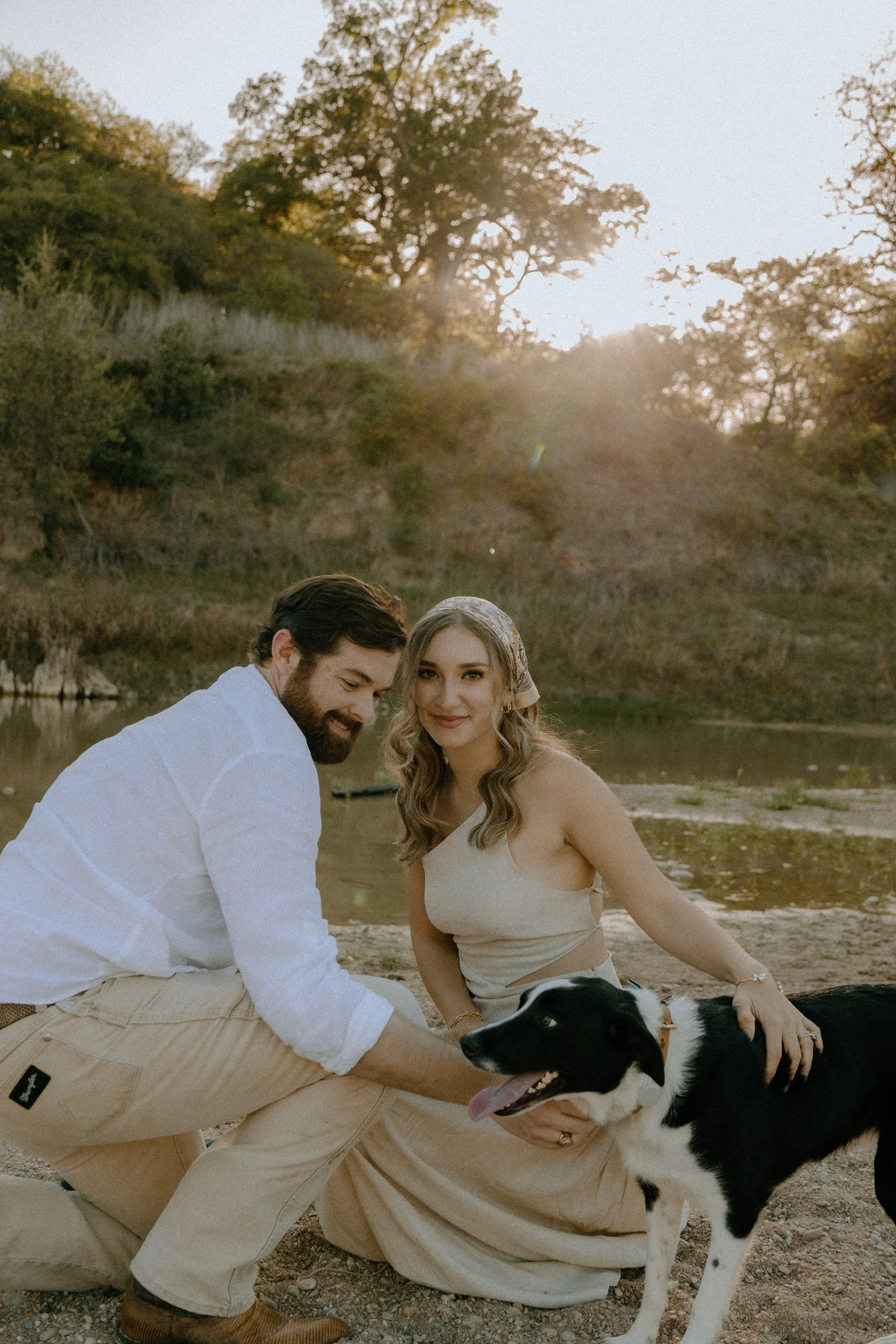 Houston & Texas Family, Couples, Newborn, Maternity, Bridal Photography – Couple cuddling by riverbank in Austin TX golden hour portraits.