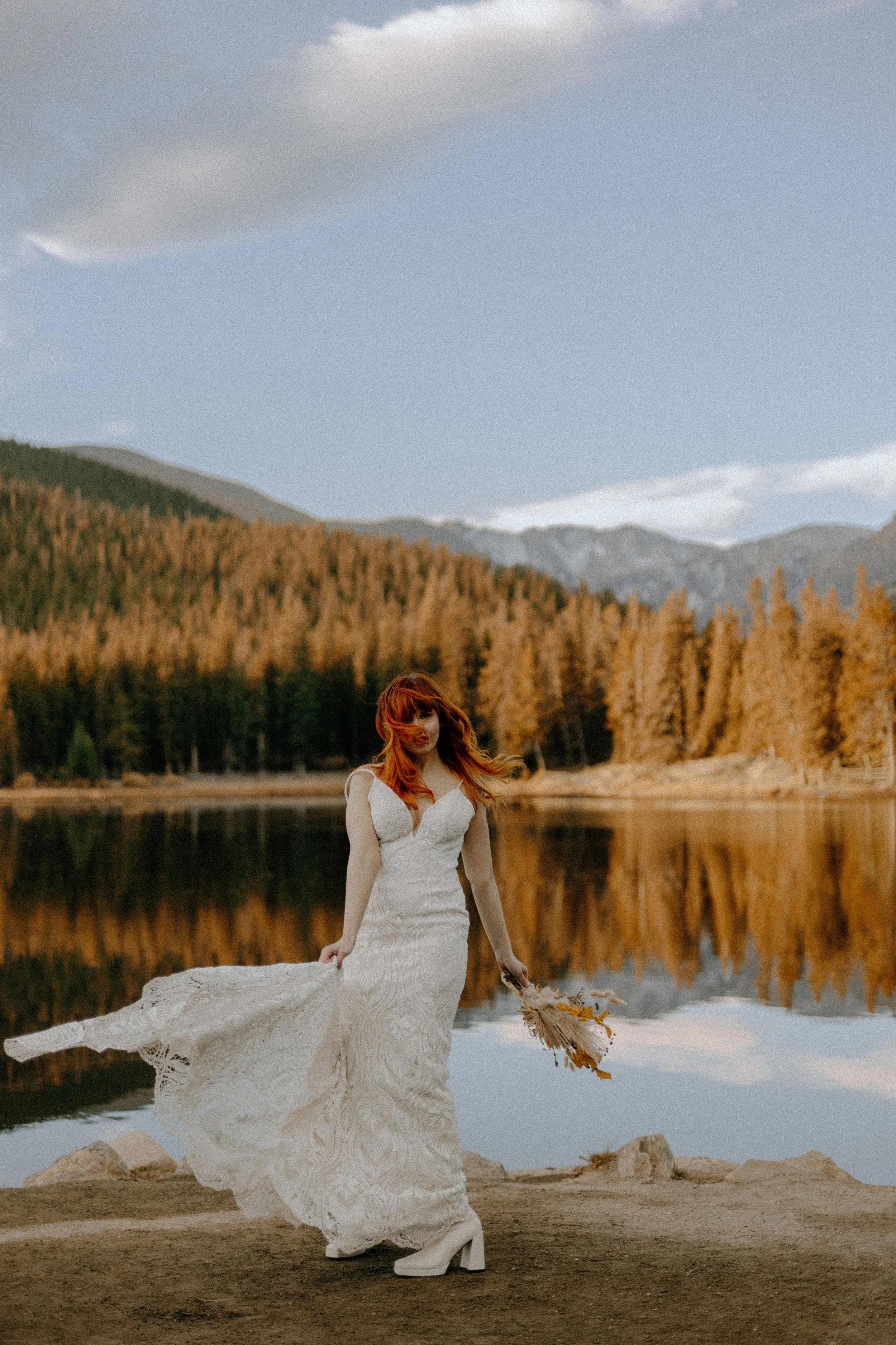 Houston & Texas Wedding & Elopement Photography – Bride holding bouquet near lake at Echo Lake Colorado elopement.