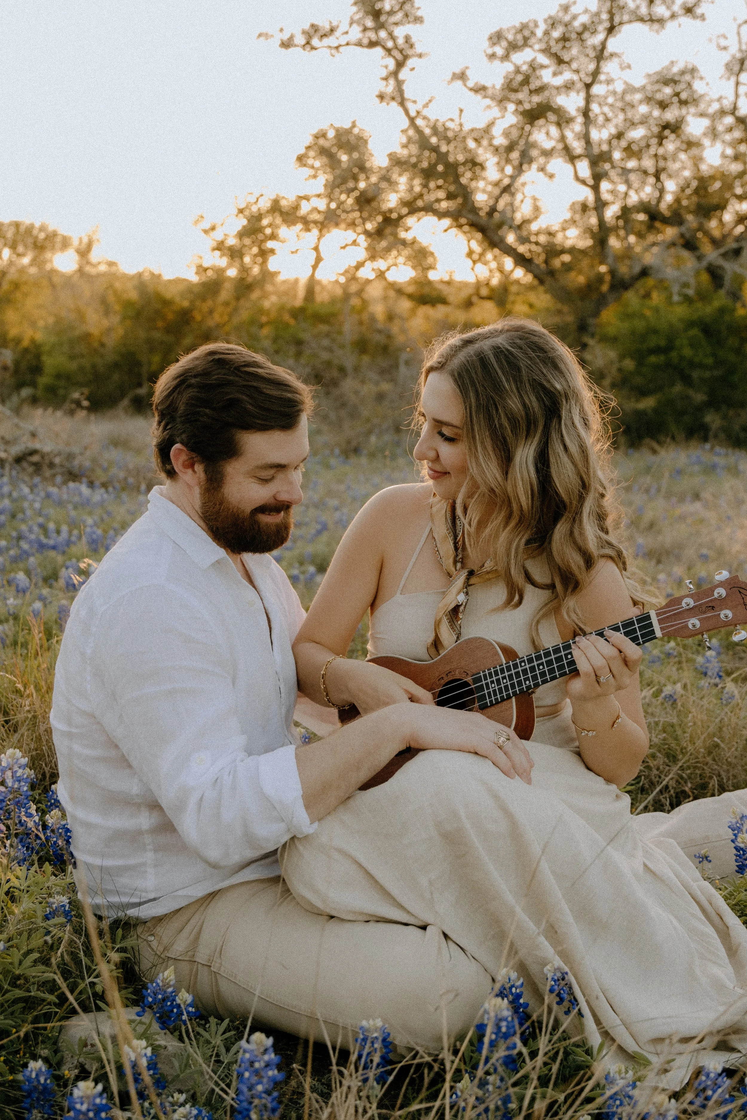 Houston & Texas Family, Couples, Newborn, Maternity, Bridal Photography – Couple seated close together in Austin TX natural field.