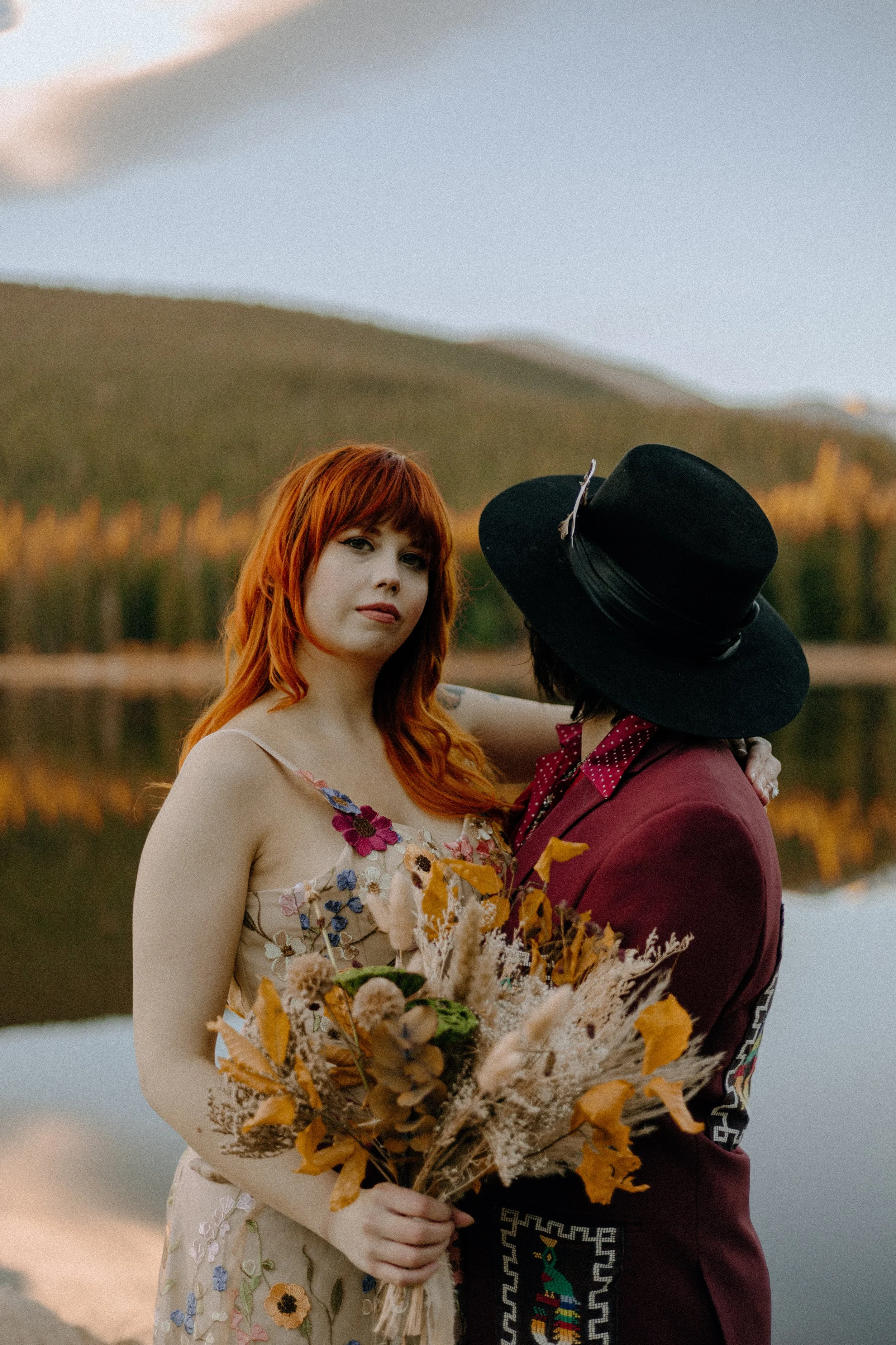 Houston & Texas Wedding & Elopement Photography – Bride holding bouquet with groom beside her in Echo Lake Colorado.