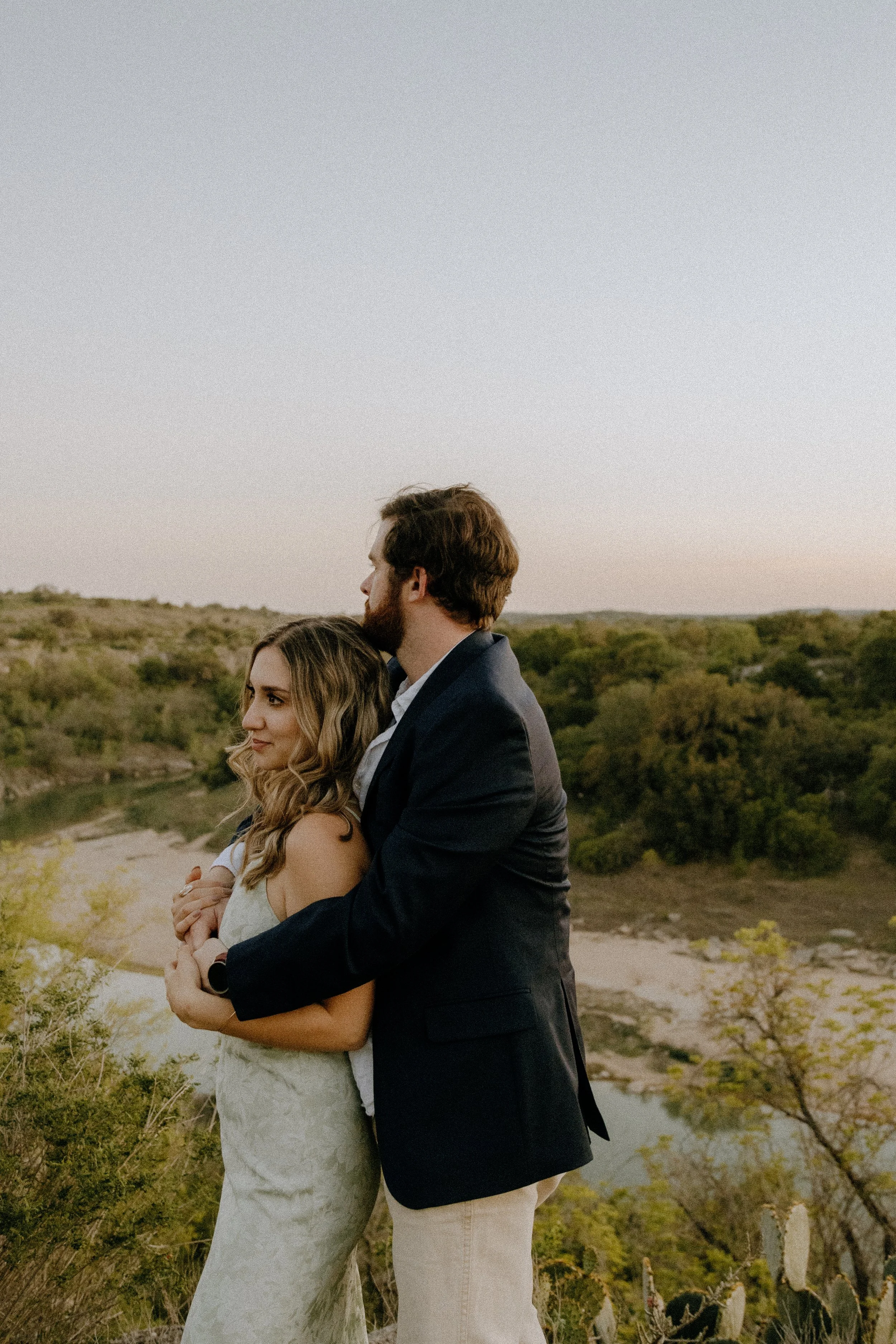 Houston & Texas Family, Couples, Newborn, Maternity, Bridal Photography – Embracing at sunset in Austin TX wildflower field.