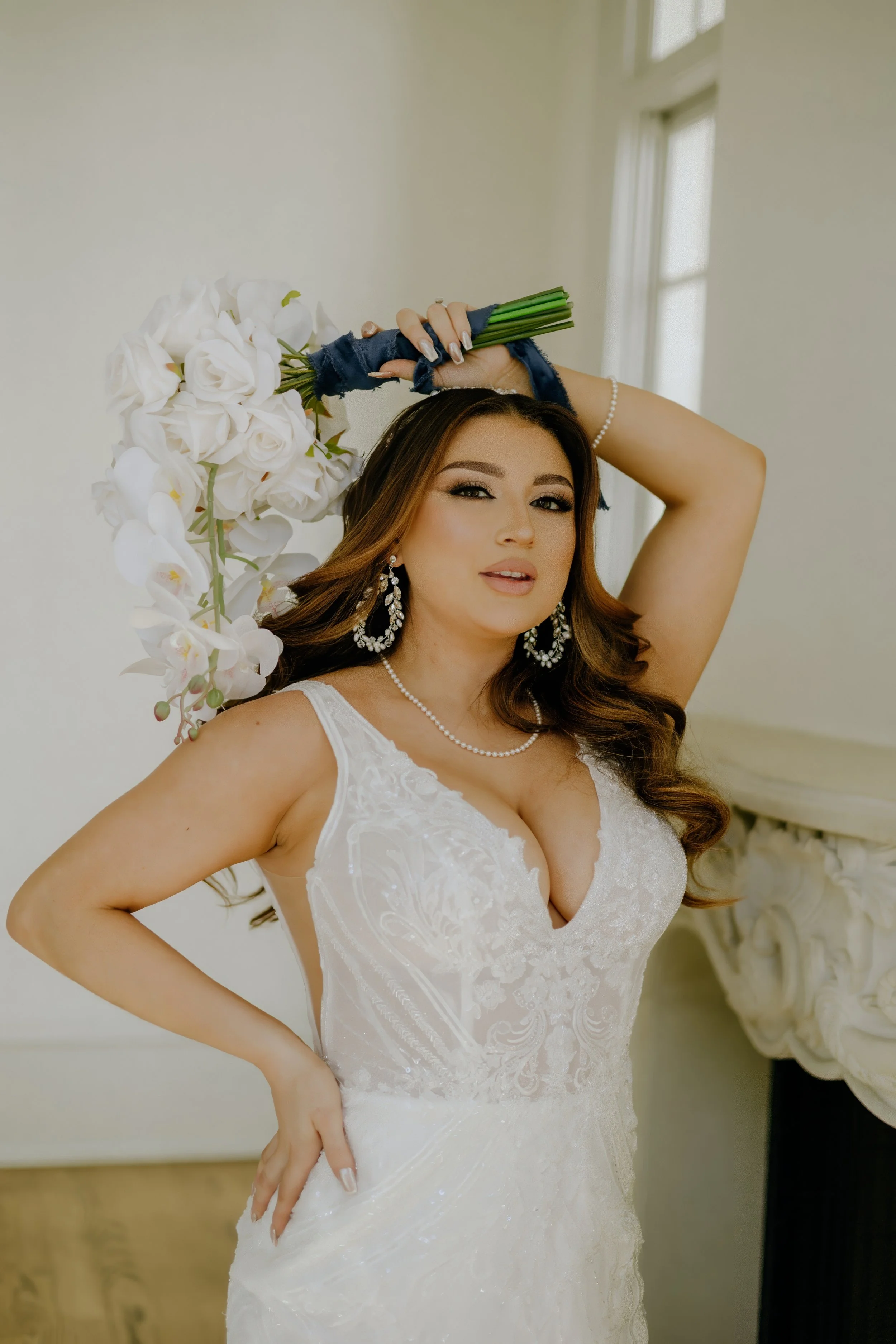 Houston & Texas Family, Couples, Newborn, Maternity, Bridal Photography – Bride gazing into ornate mirror, soft sunlight, Houston studio.