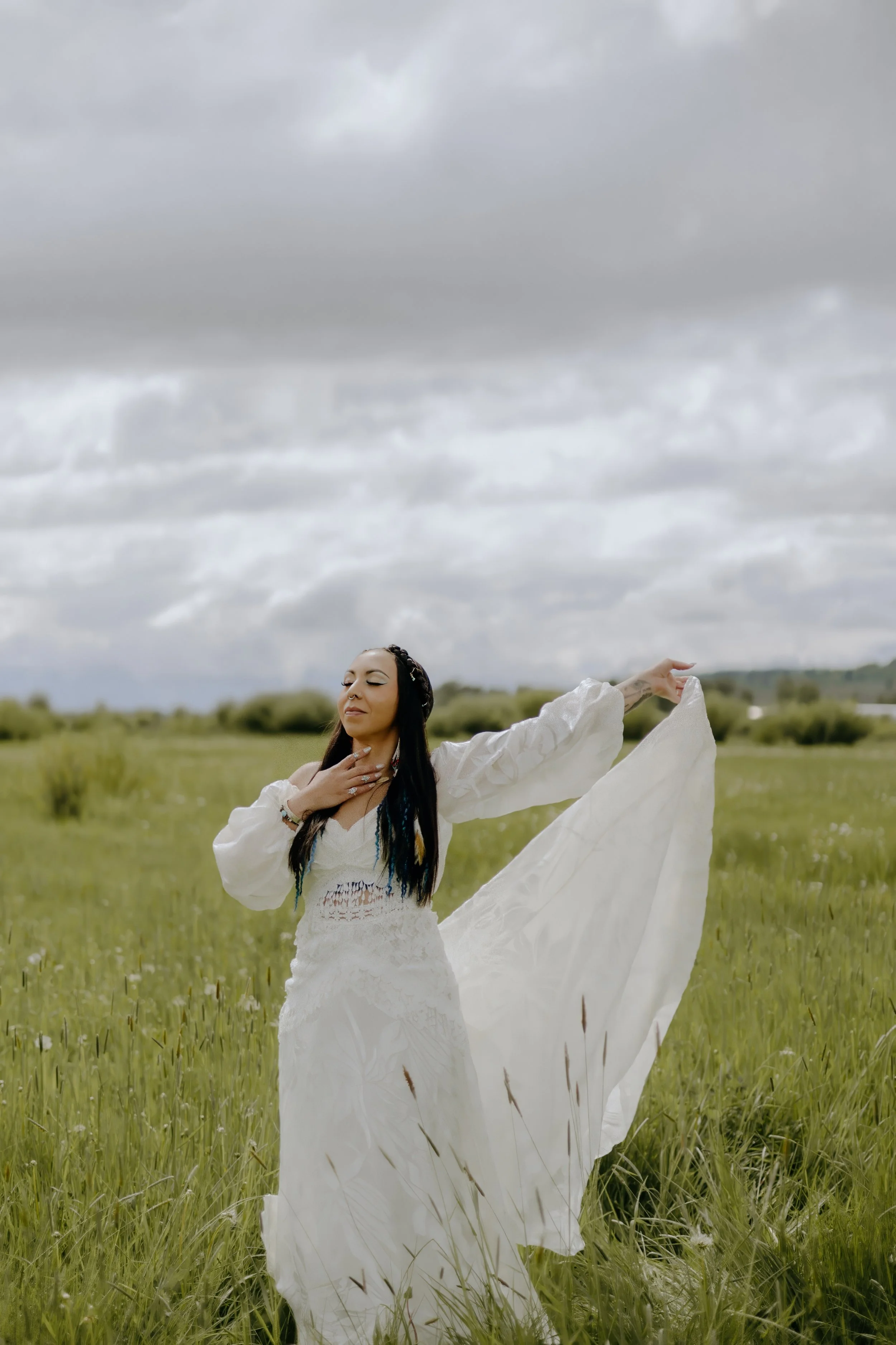 Houston & Texas Wedding & Elopement Photography – Bride extending arm gracefully in open meadow at Diamond Cross Ranch, Jackson WY.
