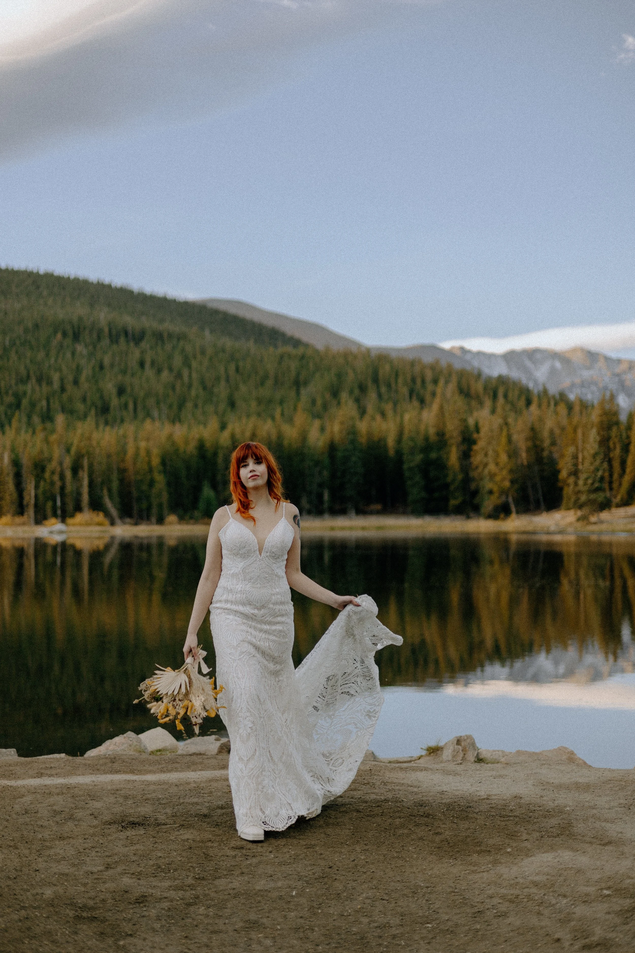 Houston & Texas Wedding & Elopement Photography – Bride gazing across alpine lake in Echo Lake Colorado elopement.