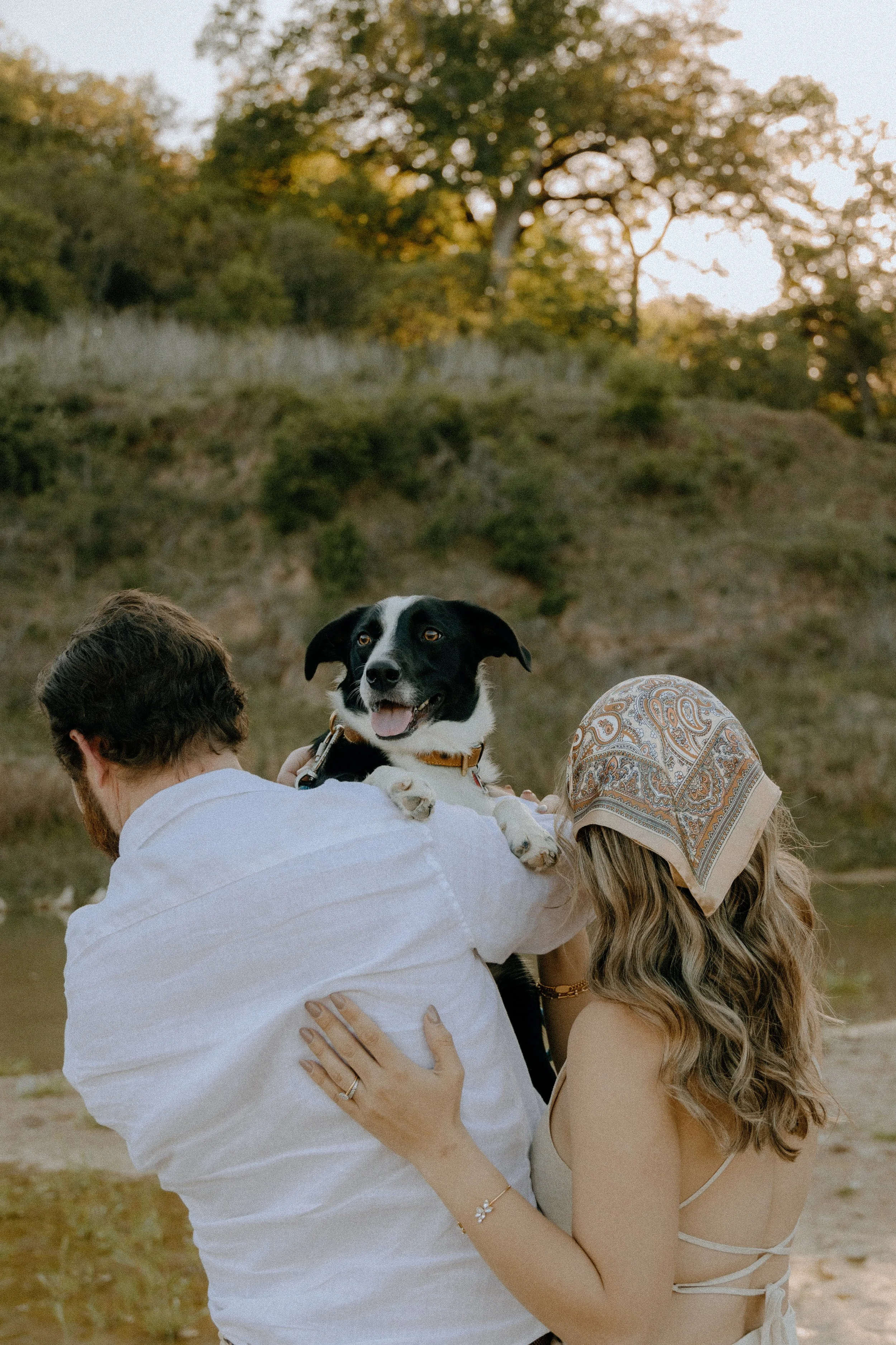 Houston & Texas Family, Couples, Newborn, Maternity, Bridal Photography – Couple cuddling with dog in Austin TX golden meadow.