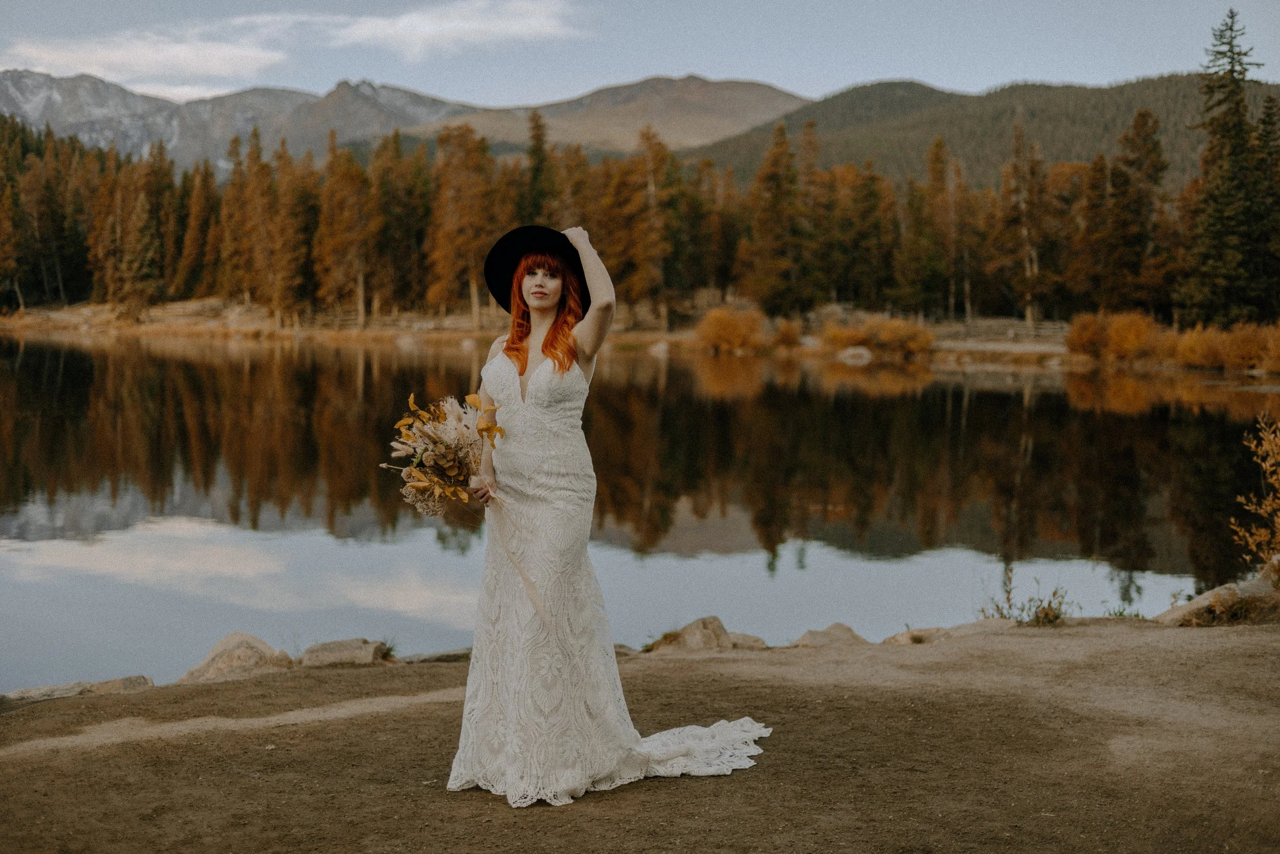Houston & Texas Wedding & Elopement Photography – Bride posing with gown near Echo Lake Colorado autumn reflections.
