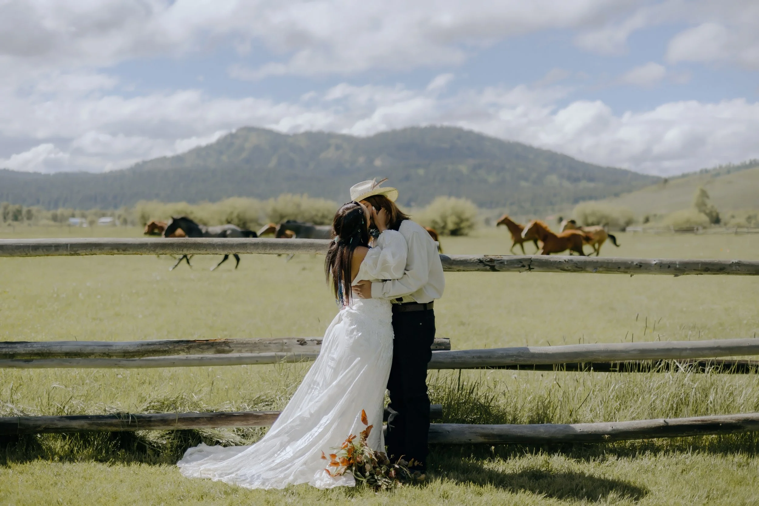 Houston & Texas Wedding & Elopement Photography – Bride and groom walking together by pasture and horses, Diamond Cross Ranch.