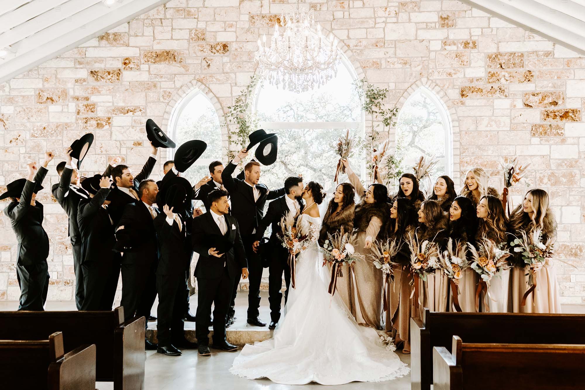 Wedding & Elopement Photography, Newlyweds and wedding party celebrating in chapel at The Chandelier of Gruene