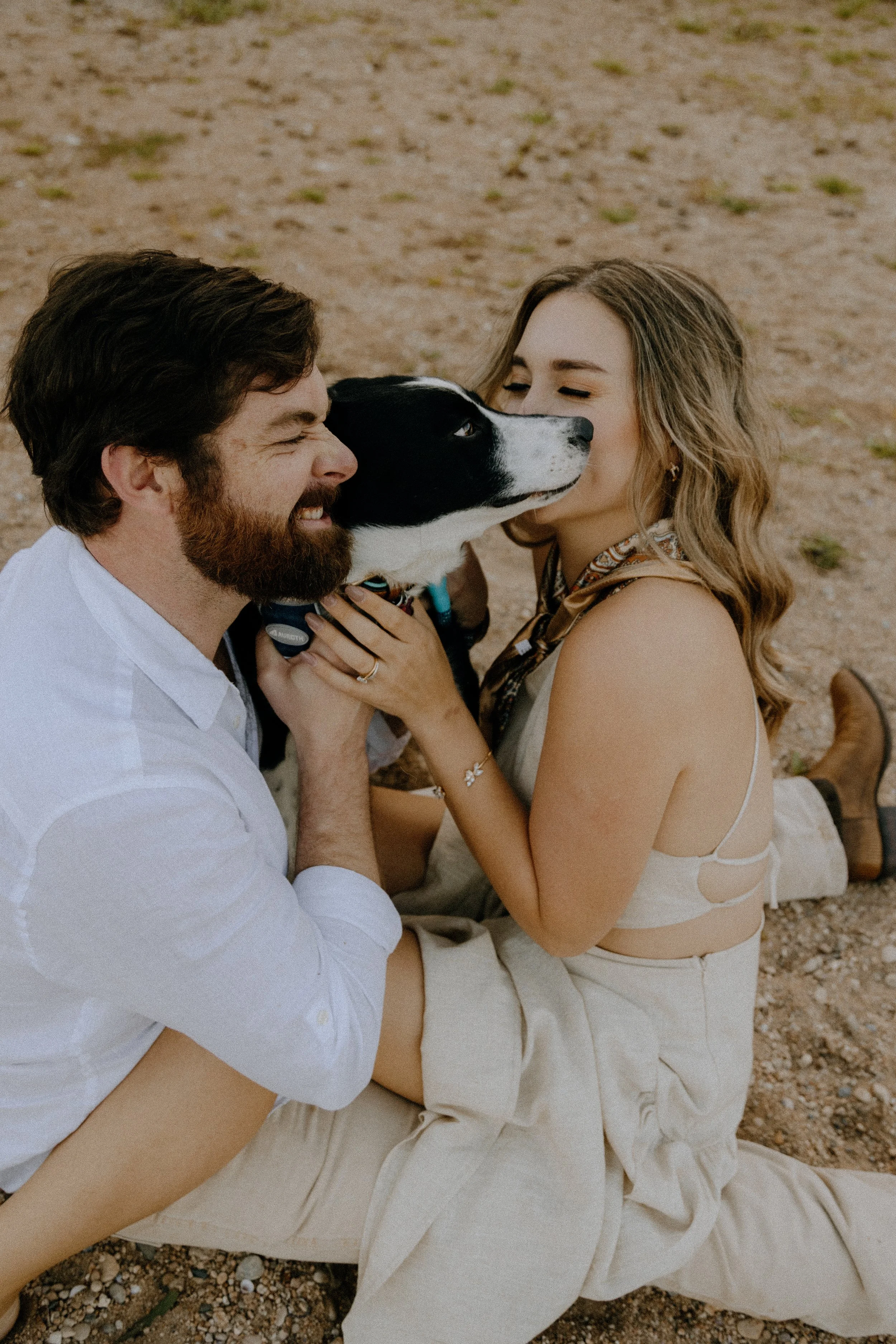 Houston & Texas Family, Couples, Newborn, Maternity, Bridal Photography – Couple laughing while holding dog in Austin TX wildflower field.