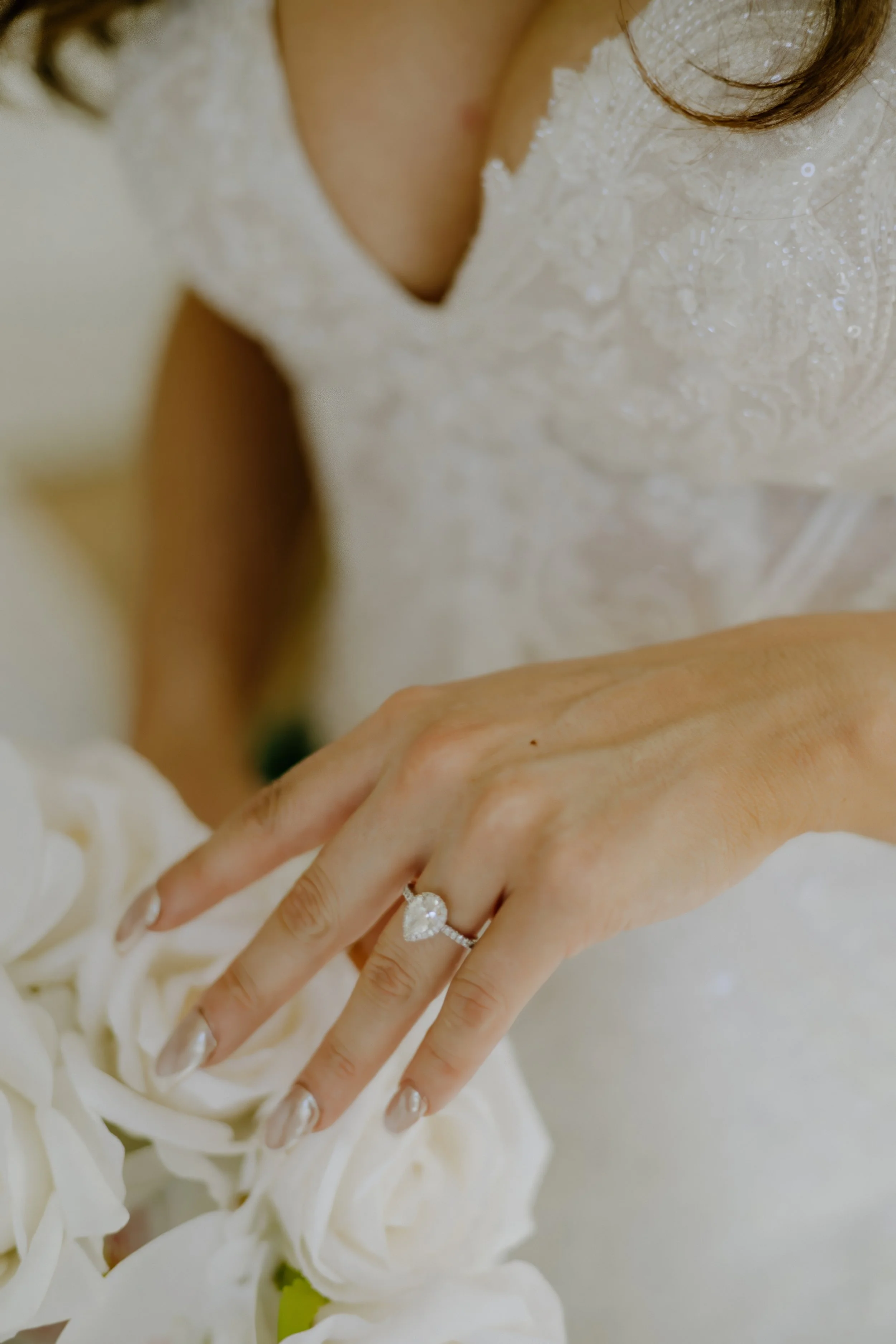 Houston & Texas Family, Couples, Newborn, Maternity, Bridal Photography – Bride’s gown spread across studio floor with chandelier, Houston.
