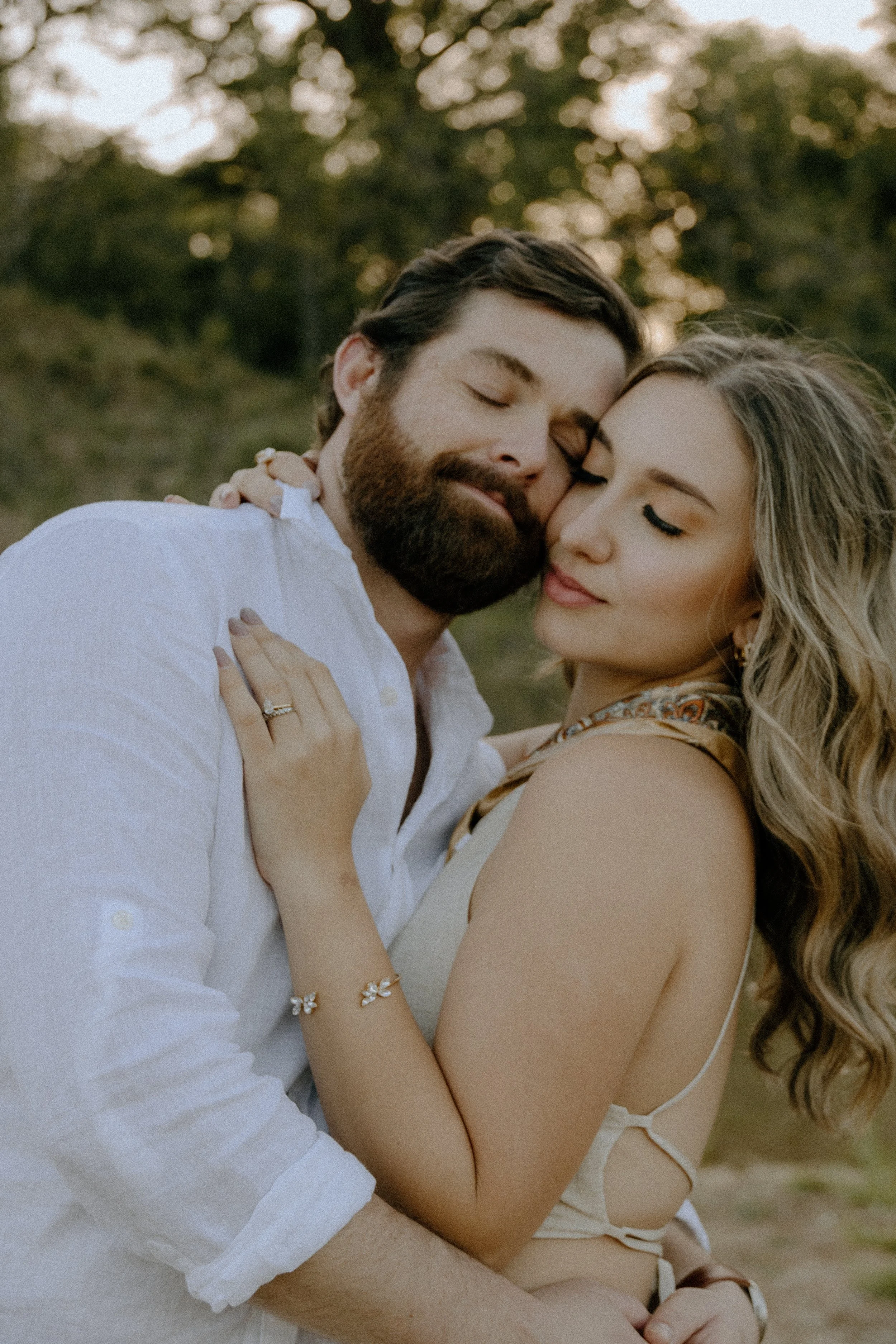 Houston & Texas Family, Couples, Newborn, Maternity, Bridal Photography – Couple hugging in Austin TX golden meadow at sunset.