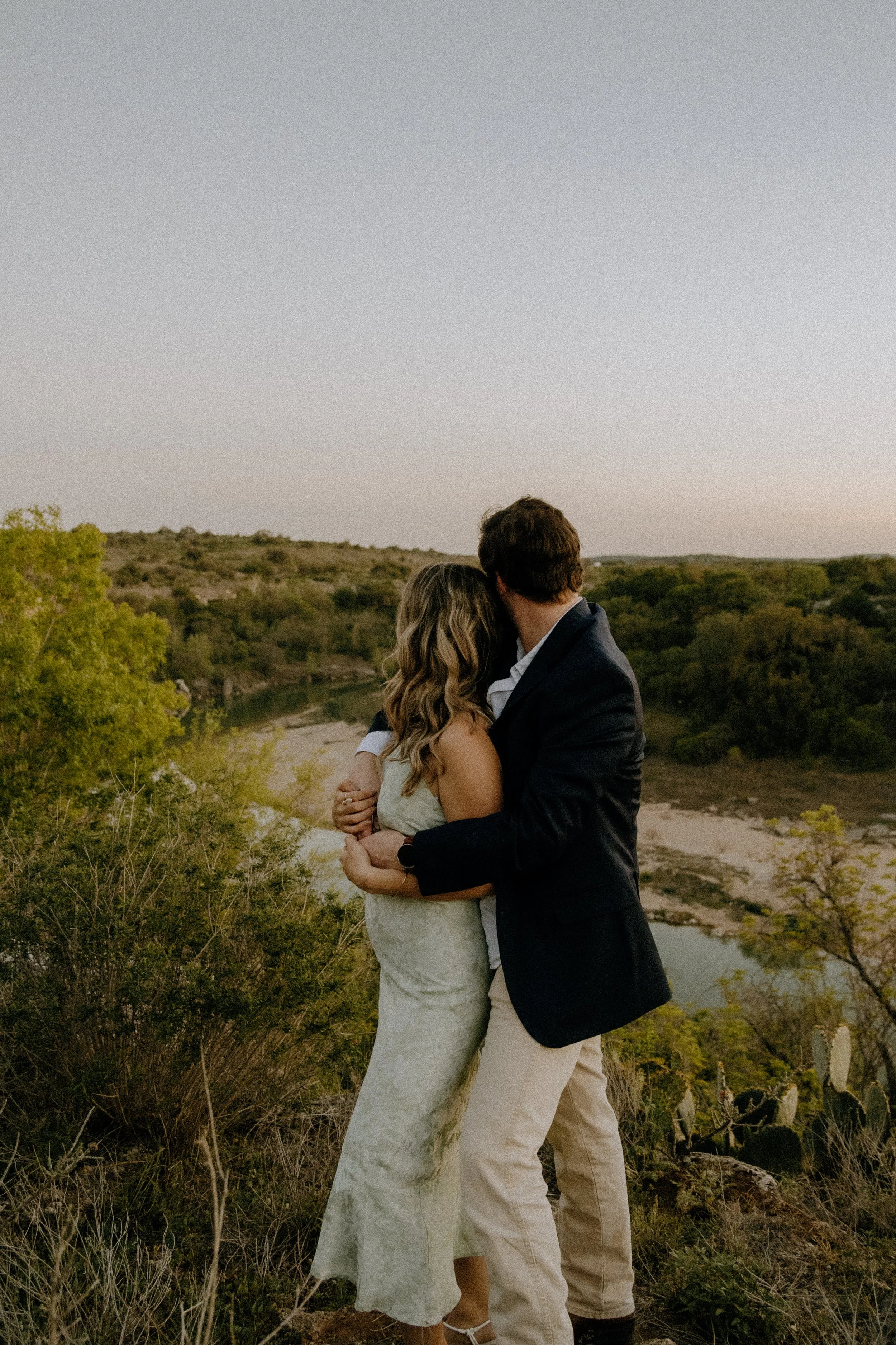 Houston & Texas Family, Couples, Newborn, Maternity, Bridal Photography – Couple dancing playfully at golden hour in Austin TX hills.