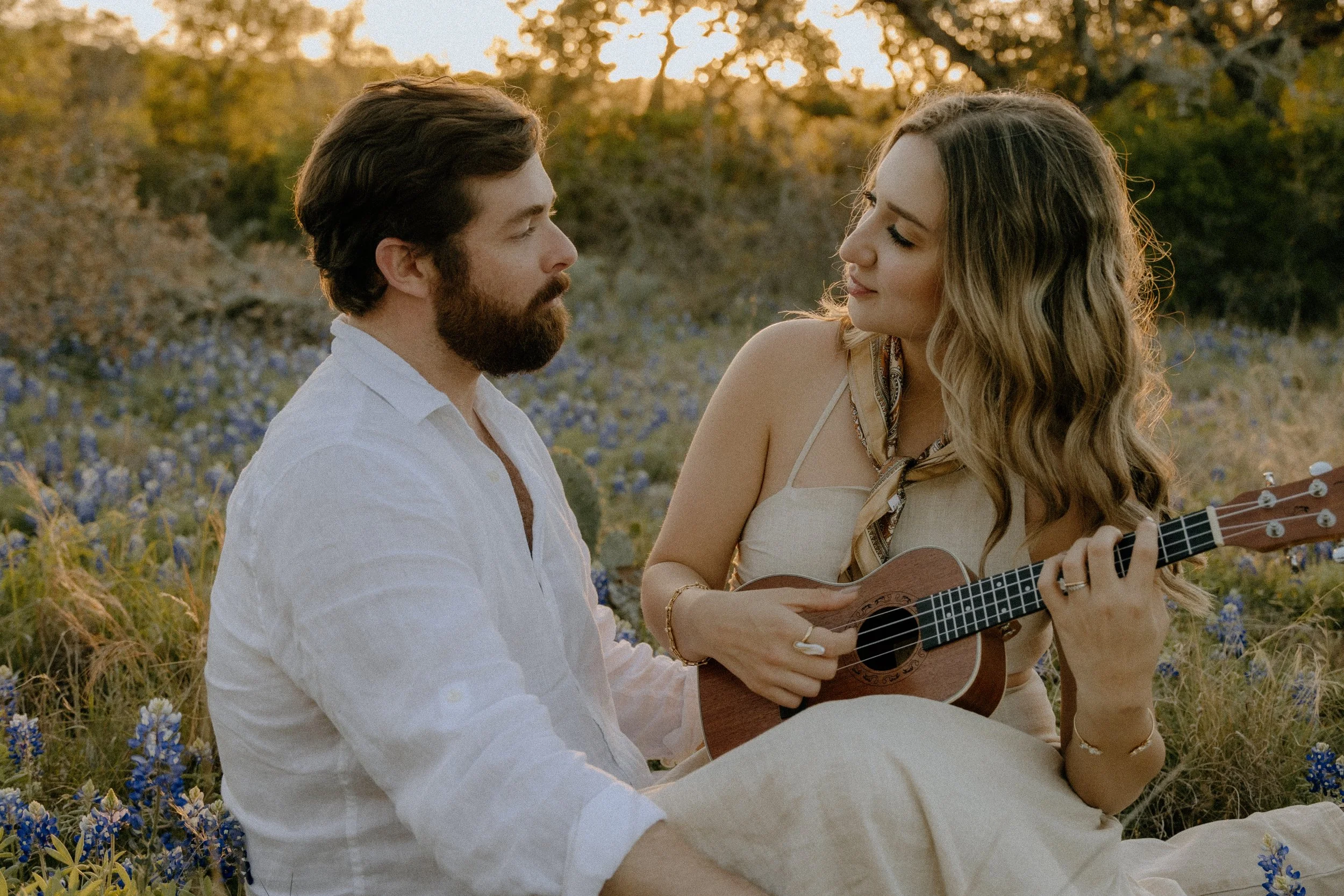 Houston & Texas Family, Couples, Newborn, Maternity, Bridal Photography – Couple laughing together at sunset in Austin TX wildflowers.