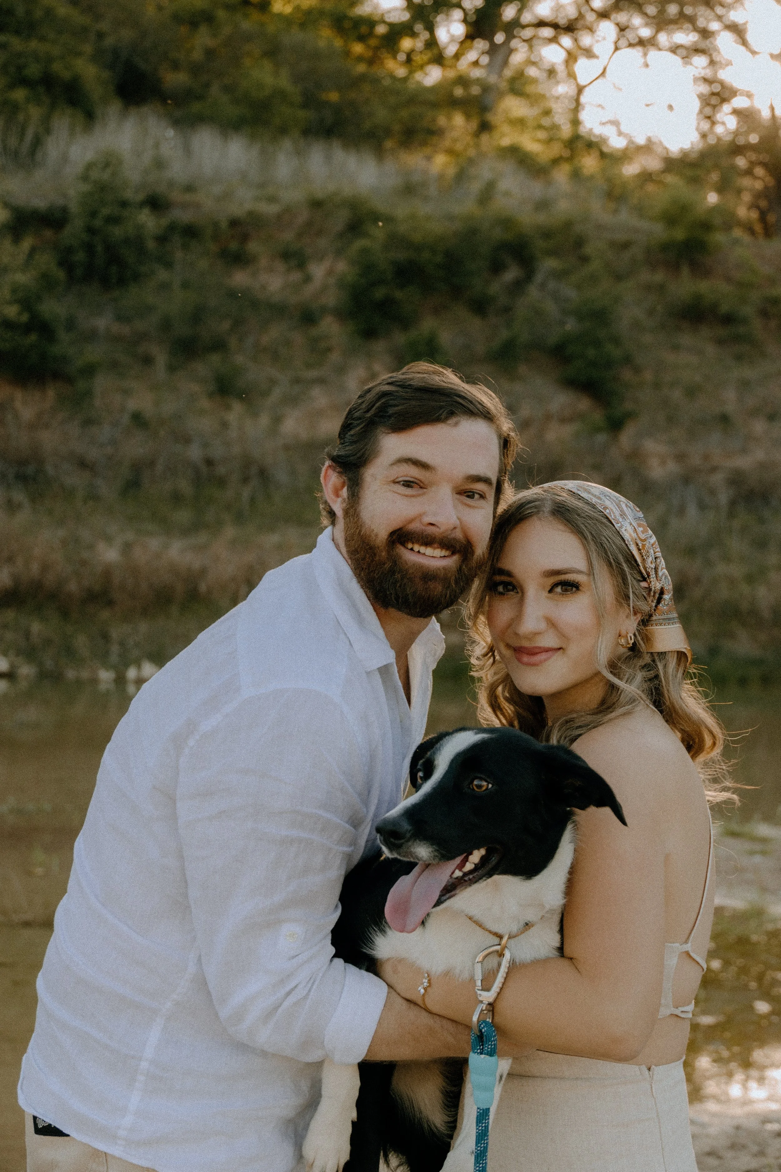 Houston & Texas Family, Couples, Newborn, Maternity, Bridal Photography – Couple smiling with dog in Austin TX outdoor family-style portraits.
