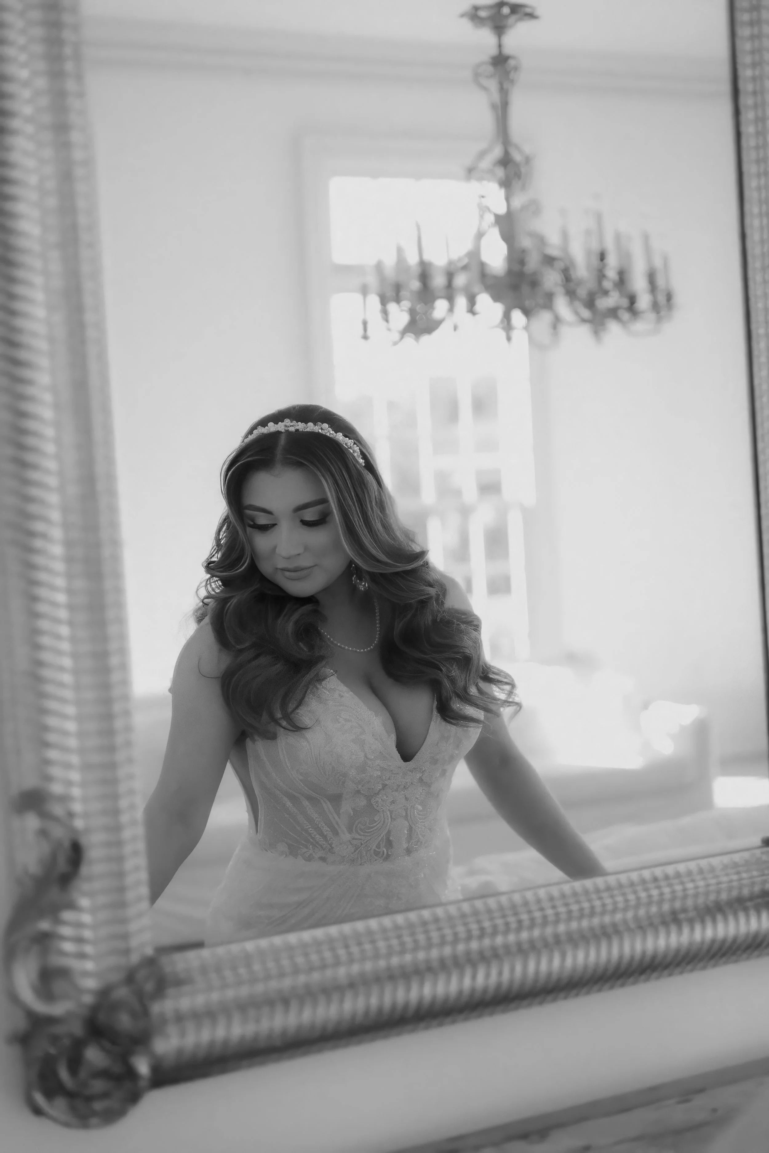 Houston & Texas Family, Couples, Newborn, Maternity, Bridal Photography – Bride framed by chandelier in elegant Houston studio.