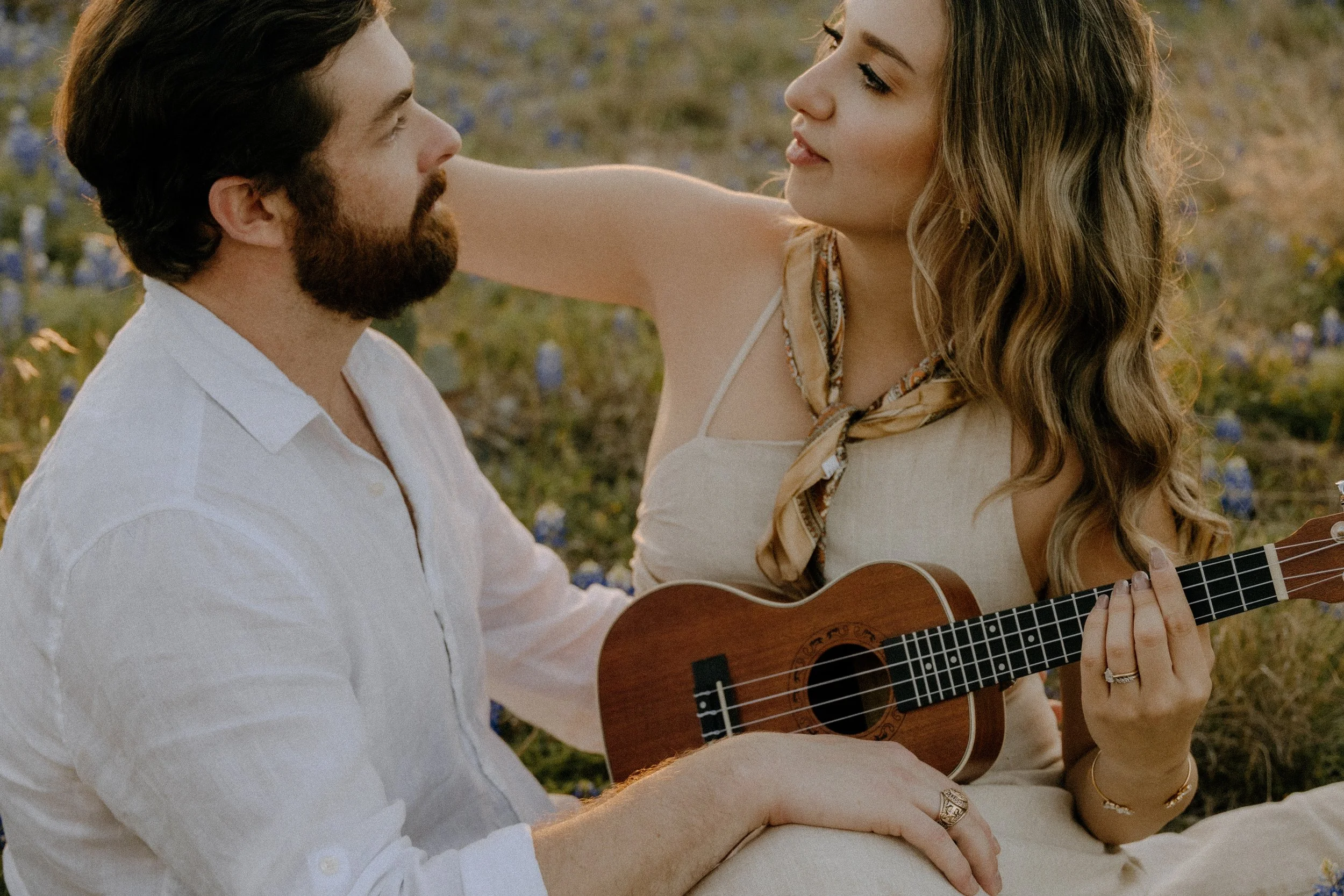 Houston & Texas Family, Couples, Newborn, Maternity, Bridal Photography – Intimate guitar moment between couple in Austin TX meadow.