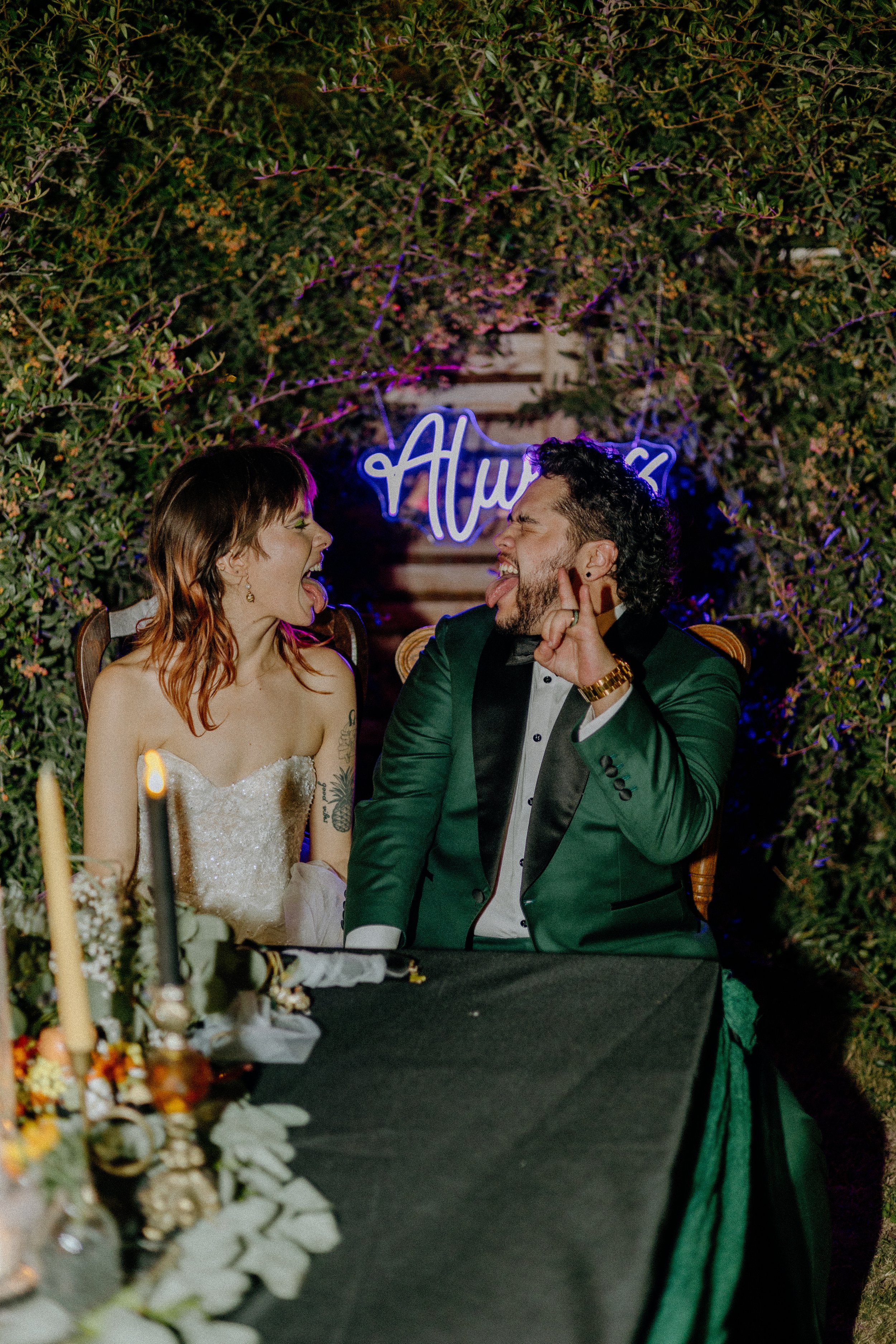 Wedding & Elopement Photography, couple laughing and smiling together sitting at a table