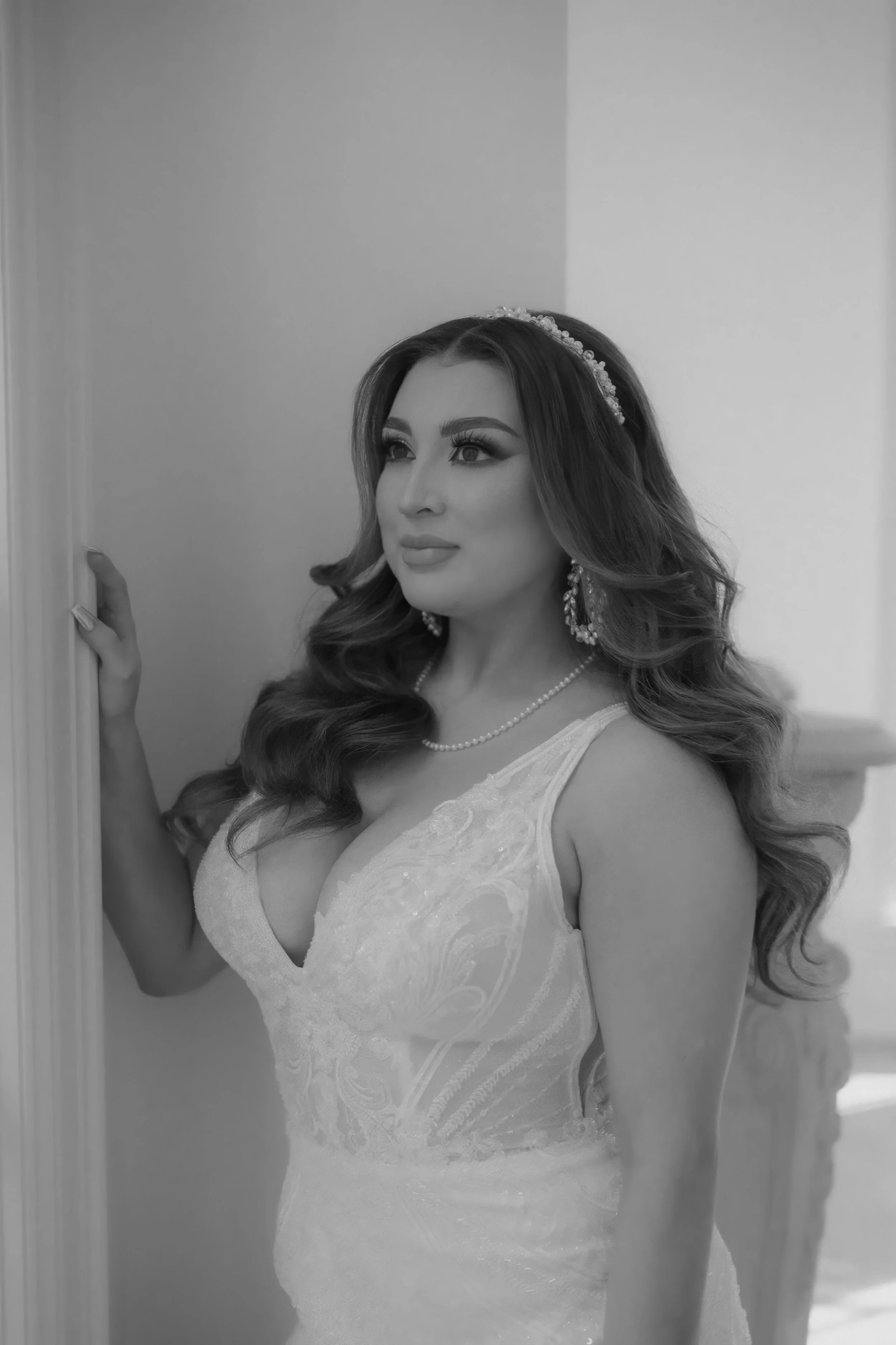 Houston & Texas Family, Couples, Newborn, Maternity, Bridal Photography – Monochrome portrait of bride with hand in hair, Houston light-filled space.