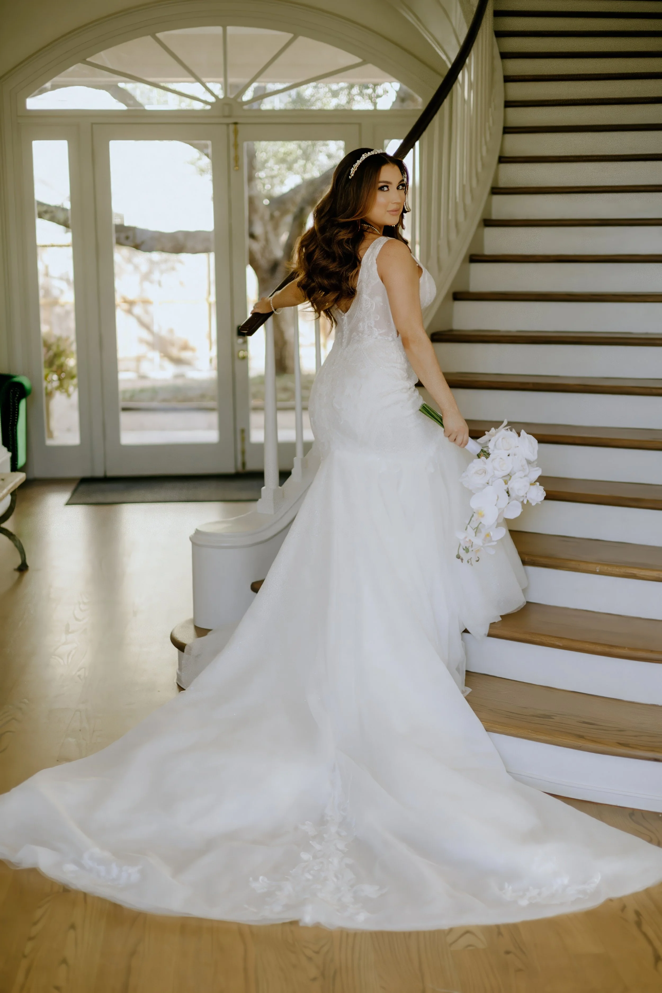 Houston & Texas Family, Couples, Newborn, Maternity, Bridal Photography – Bride seated with bouquet on staircase, luxury Houston studio.