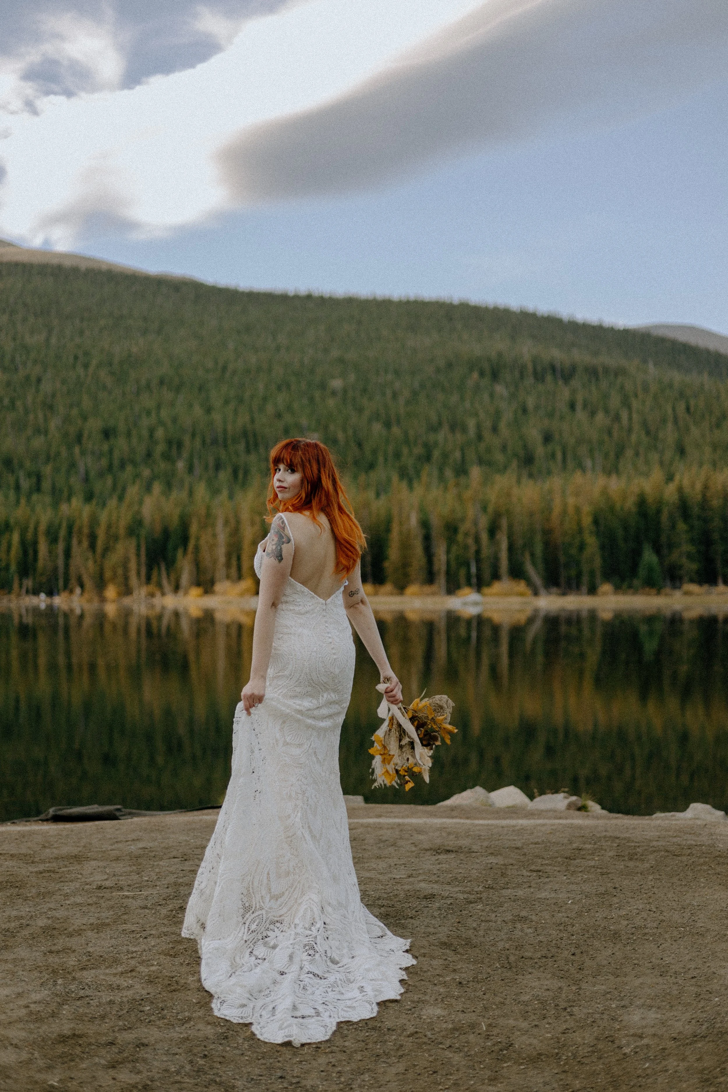 Houston & Texas Wedding & Elopement Photography – Bride walking near mountain lake reflection at Echo Lake Colorado.