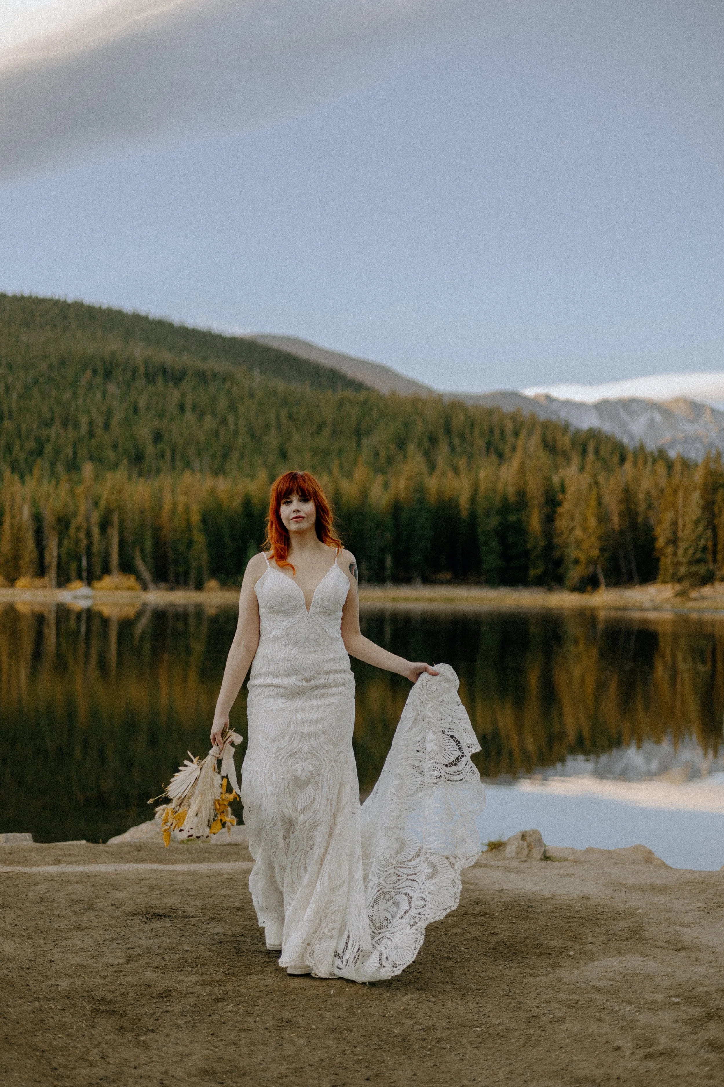 Houston & Texas Wedding & Elopement Photography – Bride posing with bouquet in Echo Lake Colorado mountain landscape.