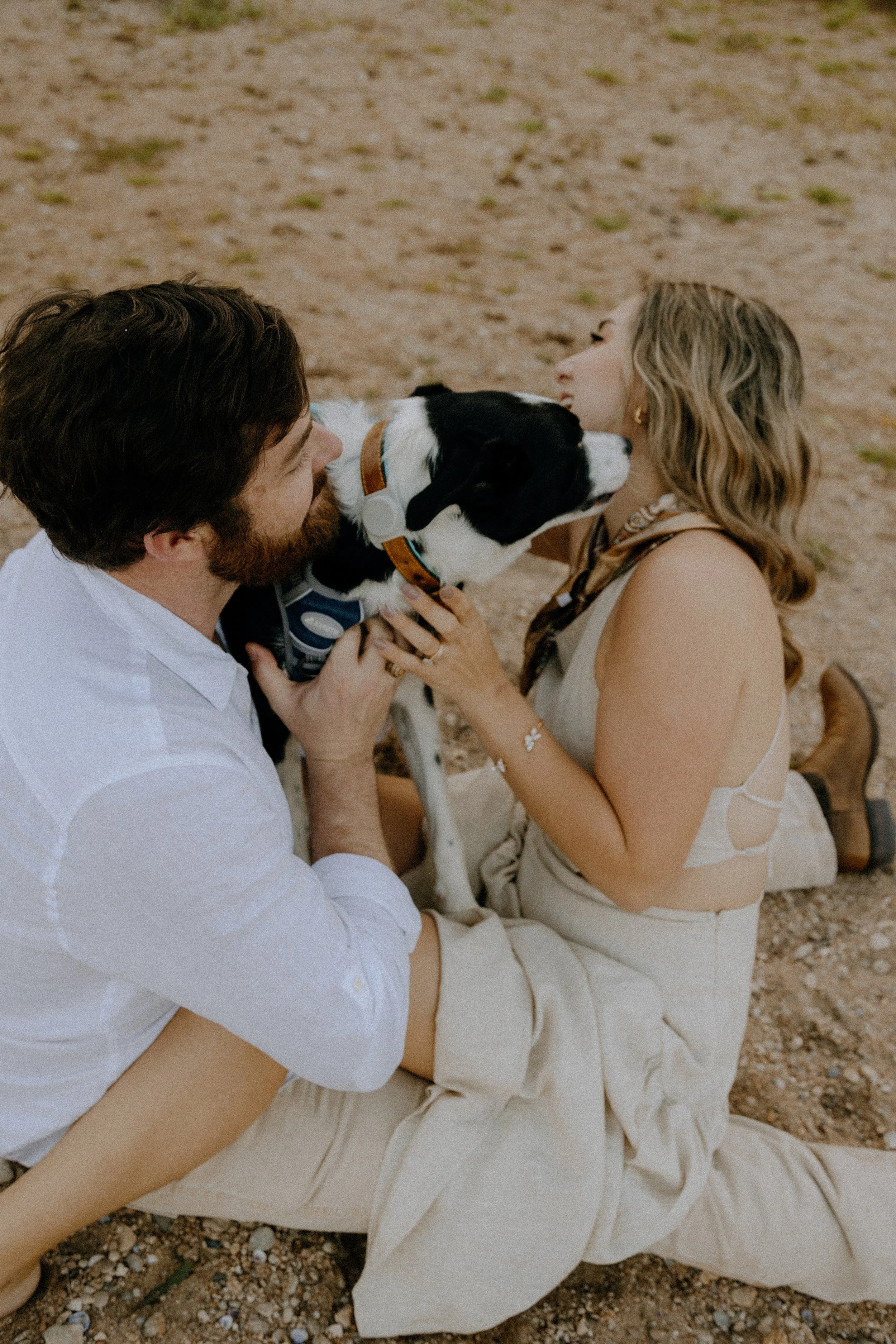 Houston & Texas Family, Couples, Newborn, Maternity, Bridal Photography – Couple kissing while holding dog, Austin TX portraits.