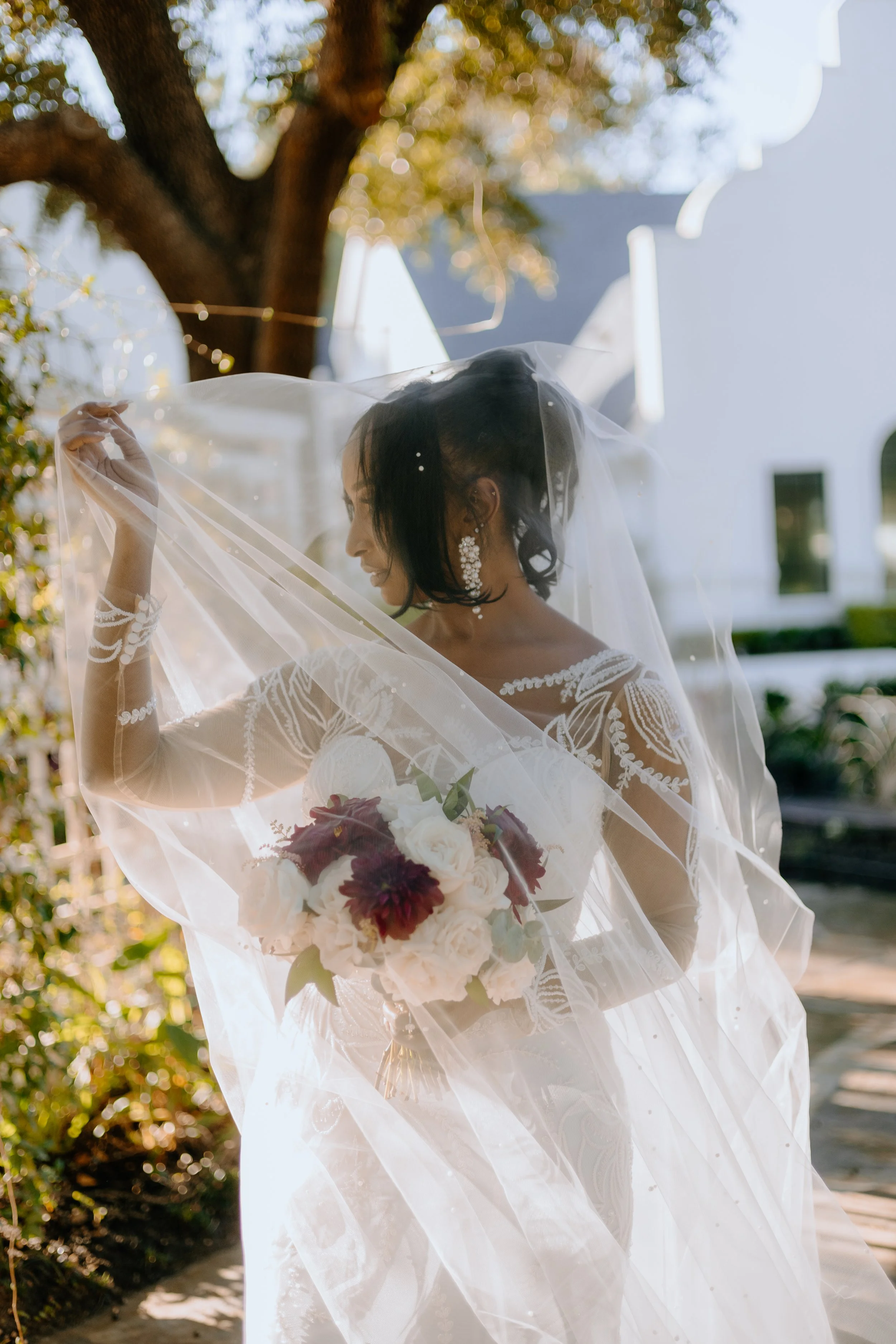 Houston & Texas Family, Couples, Newborn, Maternity, Bridal Photography – Bride posing gracefully in garden arch, Peach Orchard Venue.