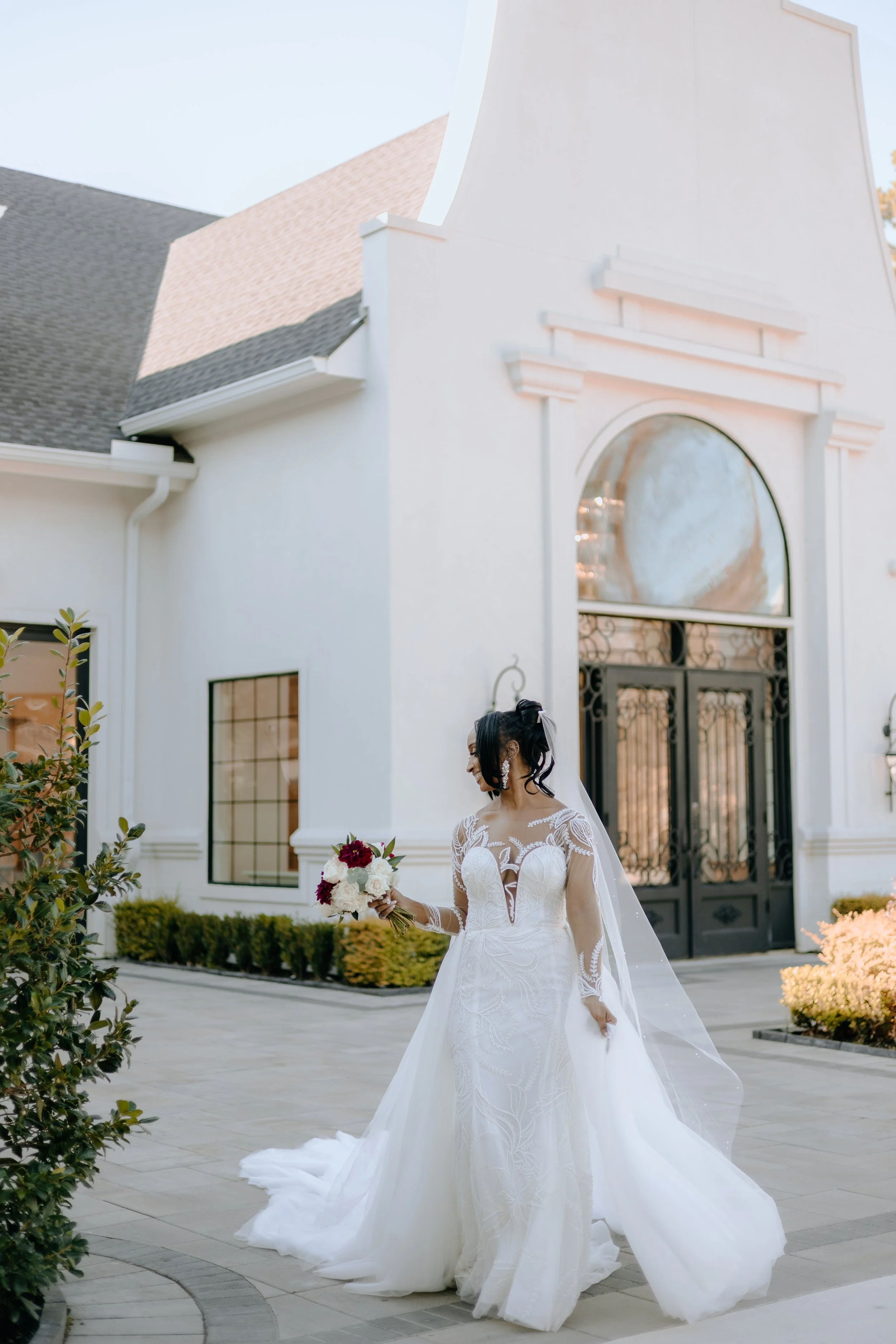 Houston & Texas Family, Couples, Newborn, Maternity, Bridal Photography – Bride walking in front of venue windows, The Woodlands TX.