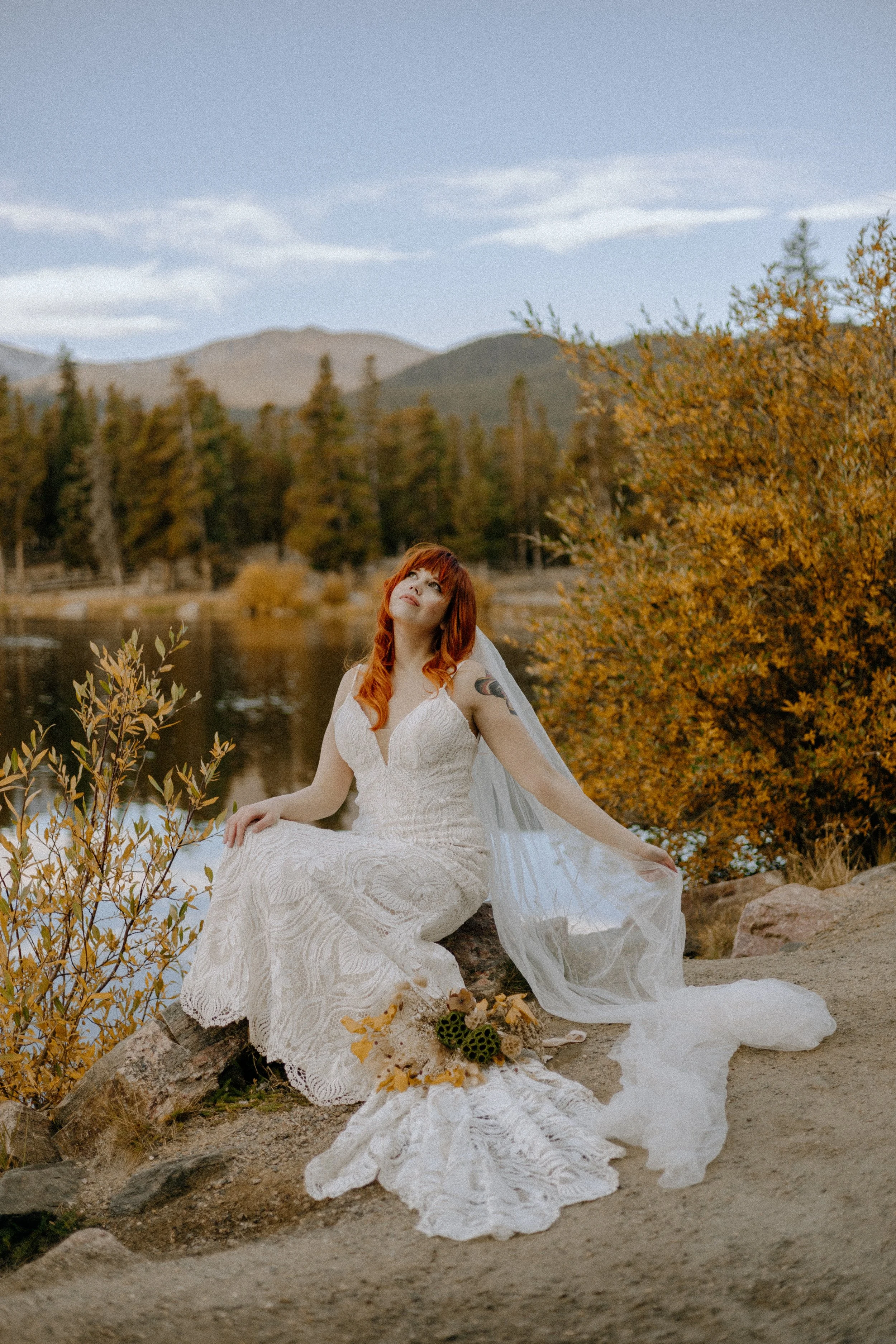 Houston & Texas Wedding & Elopement Photography – Bride seated in meadow with golden backdrop in Echo Lake Colorado.
