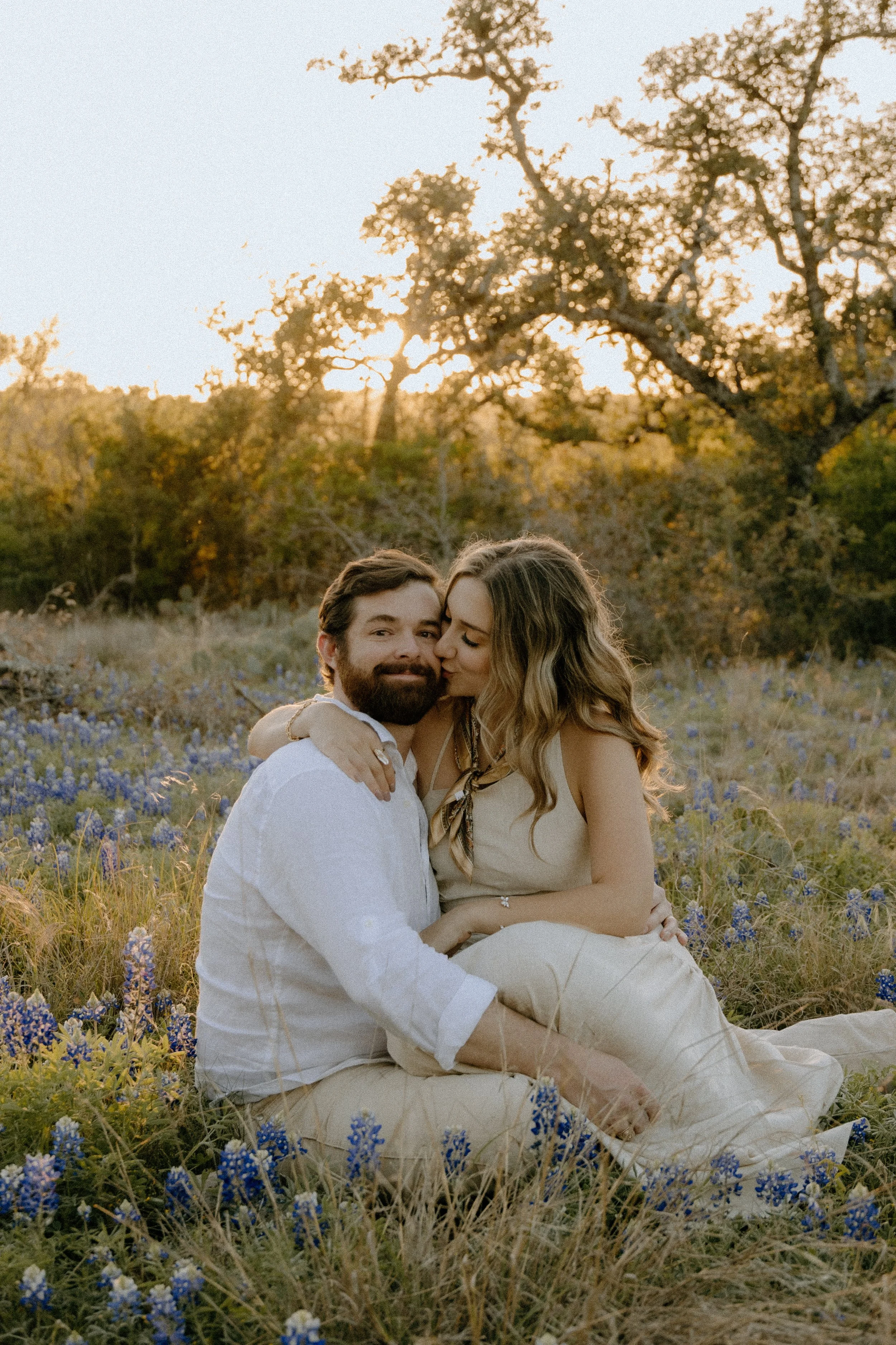 Houston & Texas Family, Couples, Newborn, Maternity, Bridal Photography – Romantic golden hour embrace in Austin TX wildflower field.