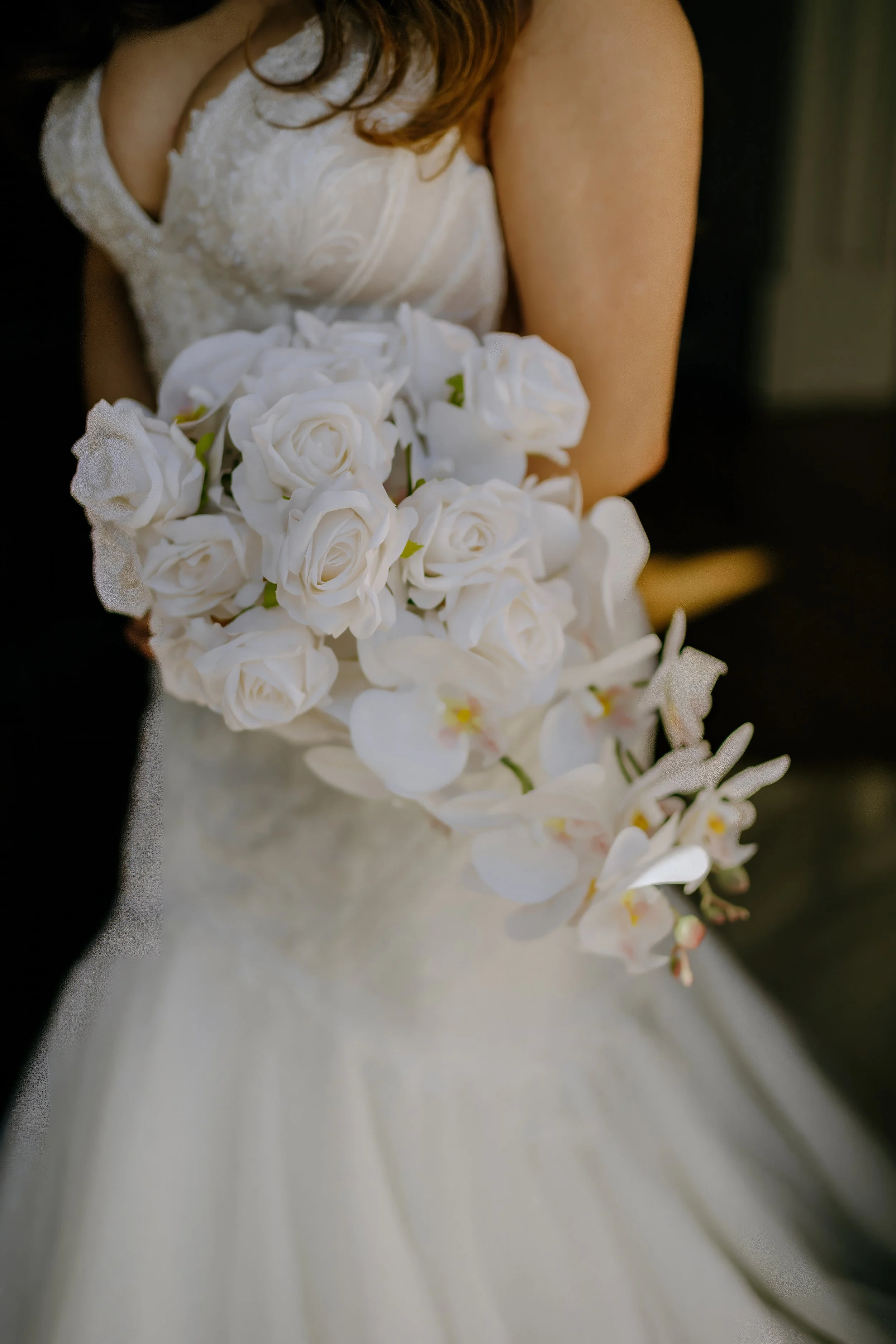 Houston & Texas Family, Couples, Newborn, Maternity, Bridal Photography – Close-up of bridal bouquet with delicate white orchids in Houston studio.