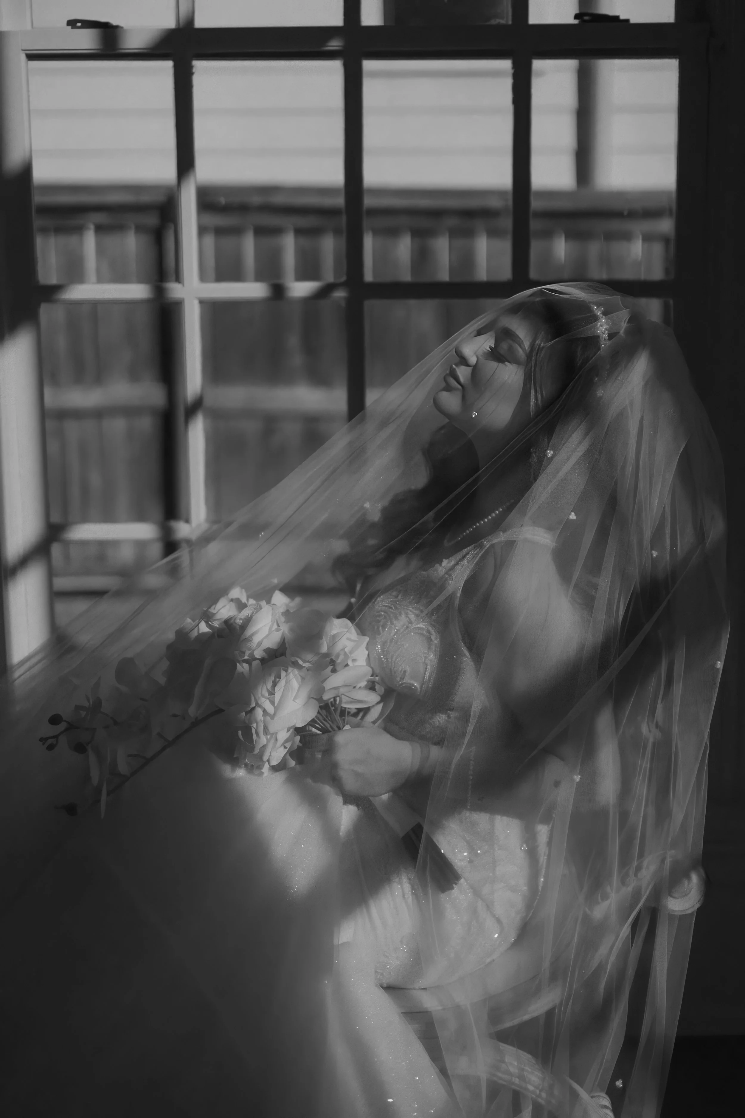 Houston & Texas Family, Couples, Newborn, Maternity, Bridal Photography – Black-and-white photo of bride with veil glowing in natural light.