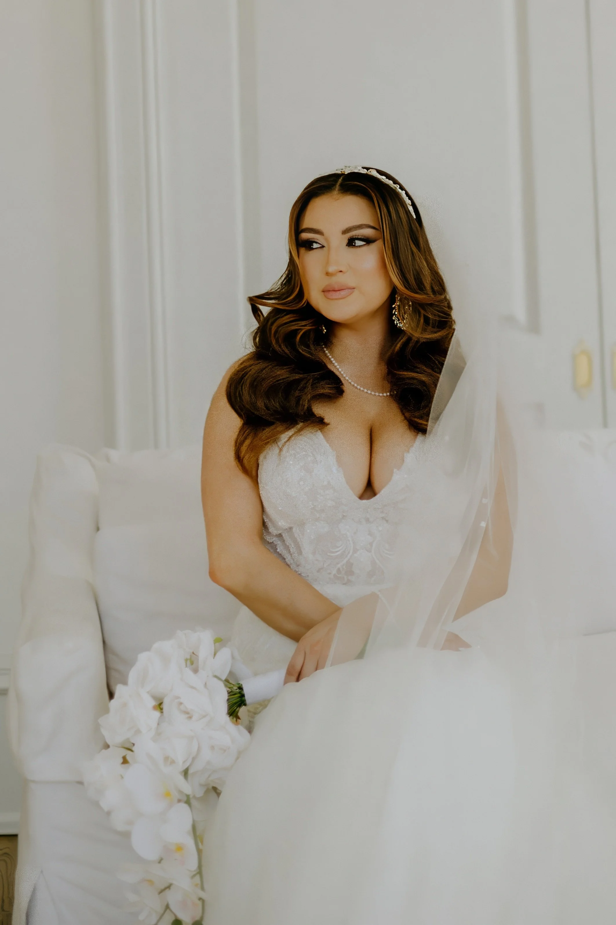 Houston & Texas Family, Couples, Newborn, Maternity, Bridal Photography – Bride seated elegantly on couch, Houston luxury studio.