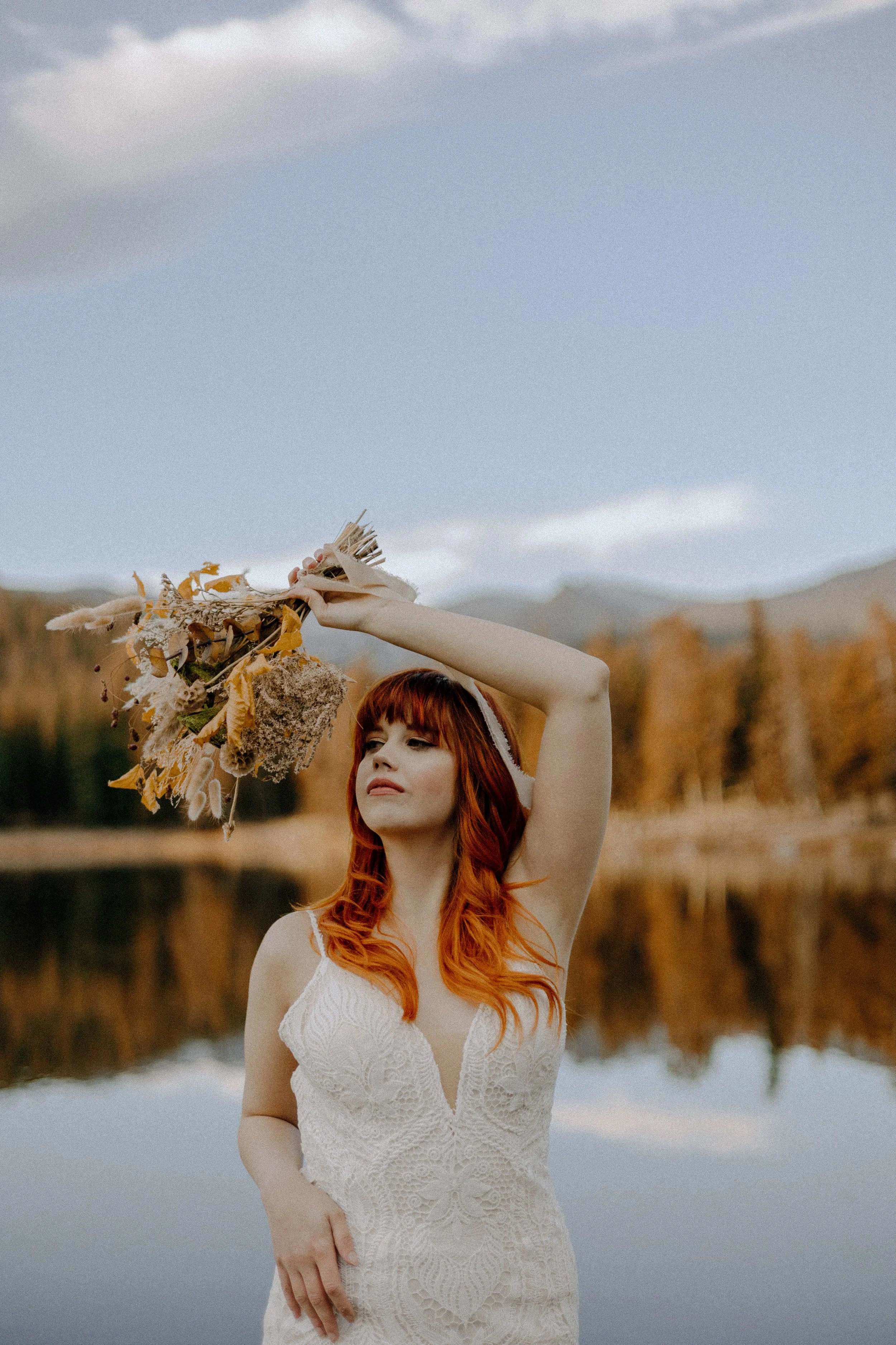 Houston & Texas Wedding & Elopement Photography – Bride with bouquet against alpine backdrop at Echo Lake Colorado.