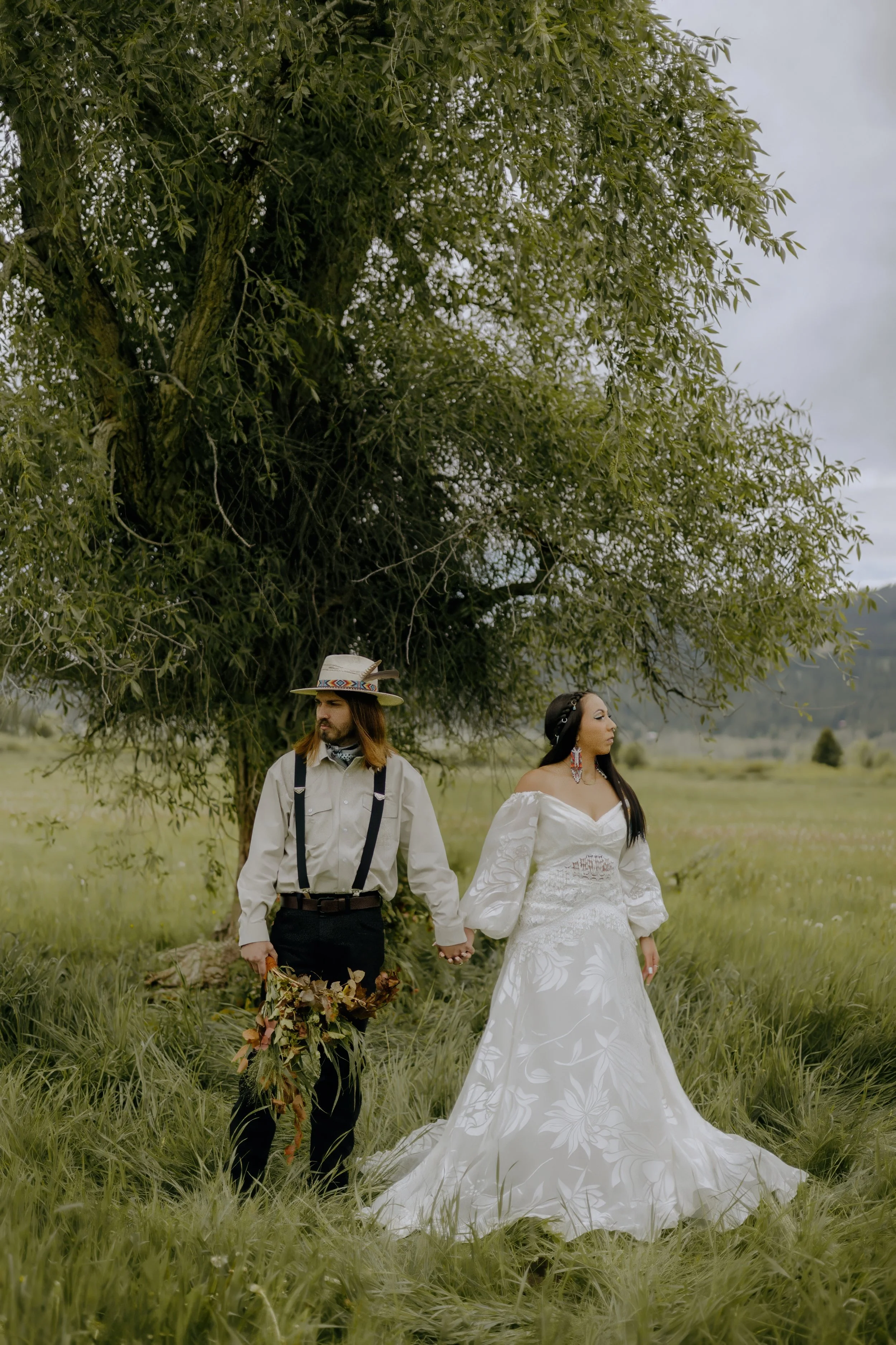 Houston & Texas Wedding & Elopement Photography – Bride walking through field with groom behind at Diamond Cross Ranch, Jackson, WY.