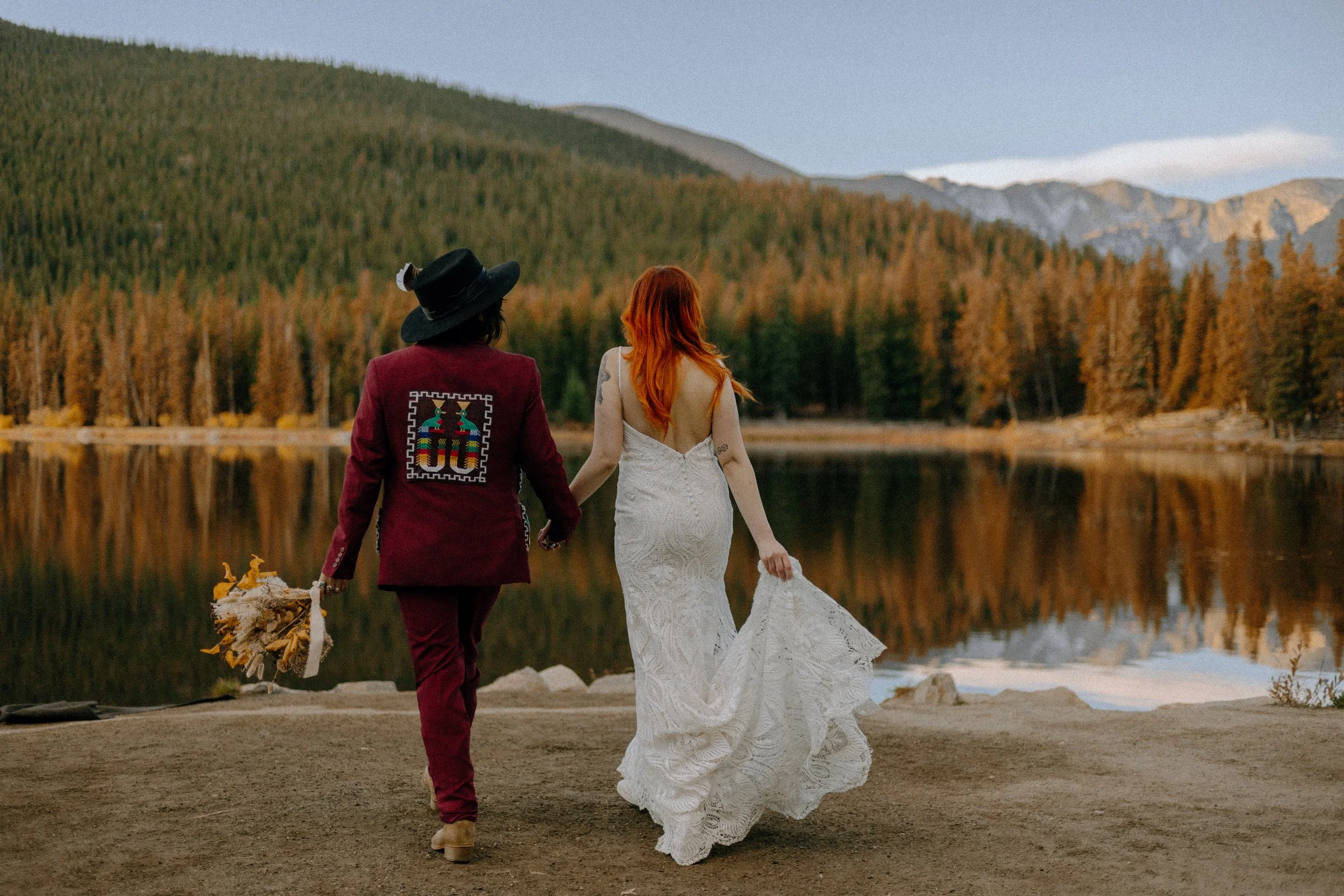 Houston & Texas Wedding & Elopement Photography – Couple holding hands by alpine lake reflection at Echo Lake Colorado.