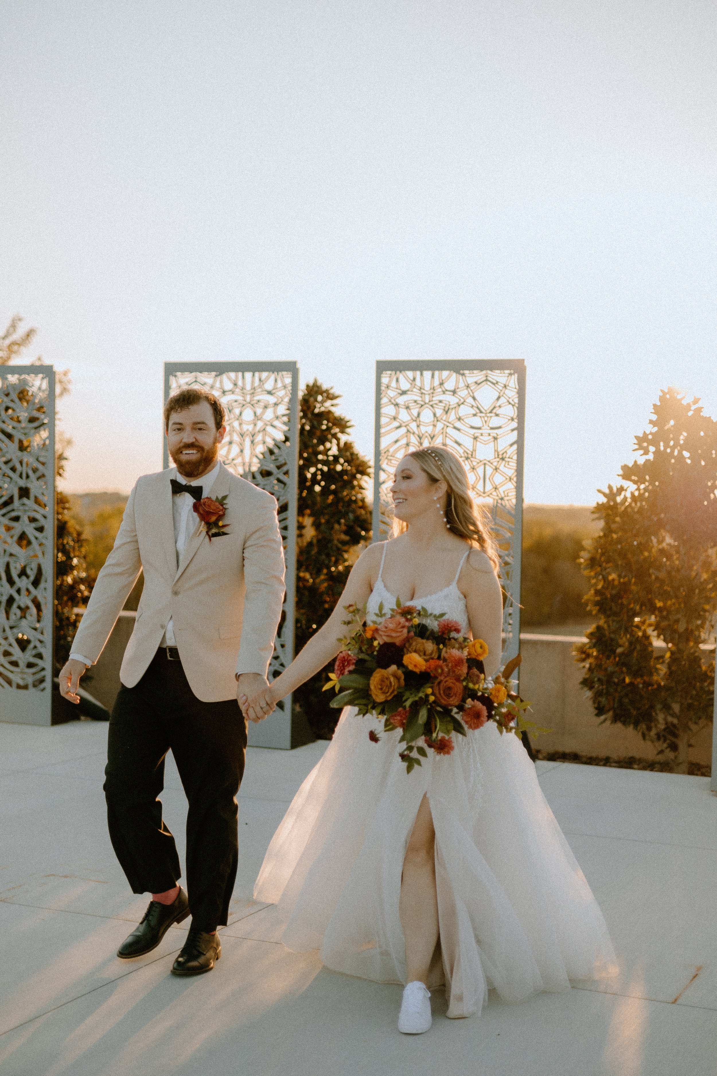 Wedding & Elopement Photography, couple walking and holding hands on roof top