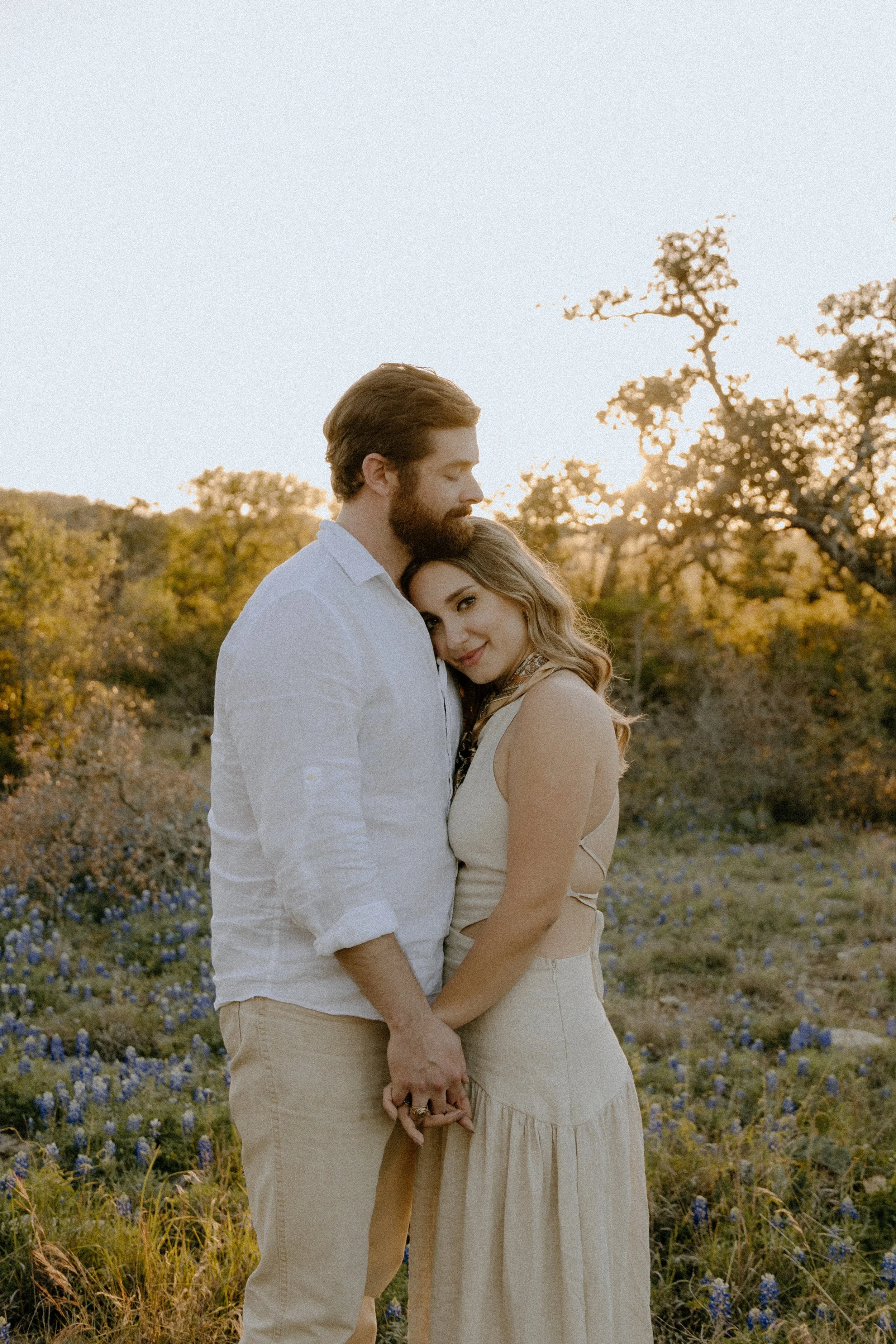 Houston & Texas Family, Couples, Newborn, Maternity, Bridal Photography – Holding hands during sunset in Austin TX wildflower field.