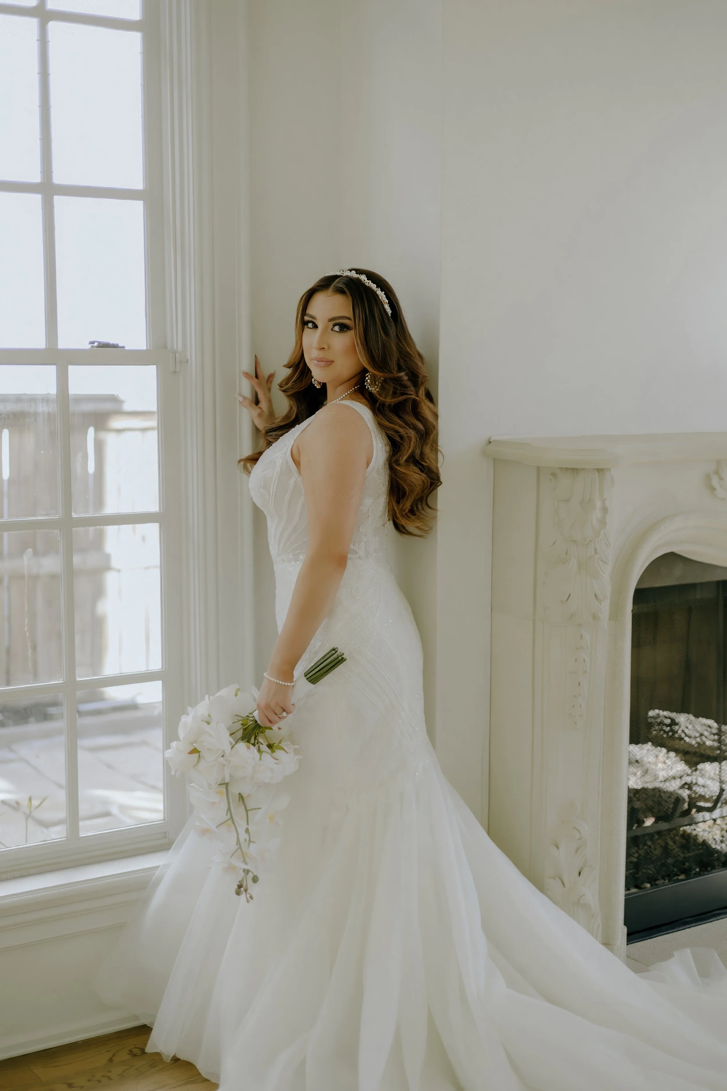 Houston & Texas Family, Couples, Newborn, Maternity, Bridal Photography – Bride standing in front of white fireplace, Houston luxury studio.