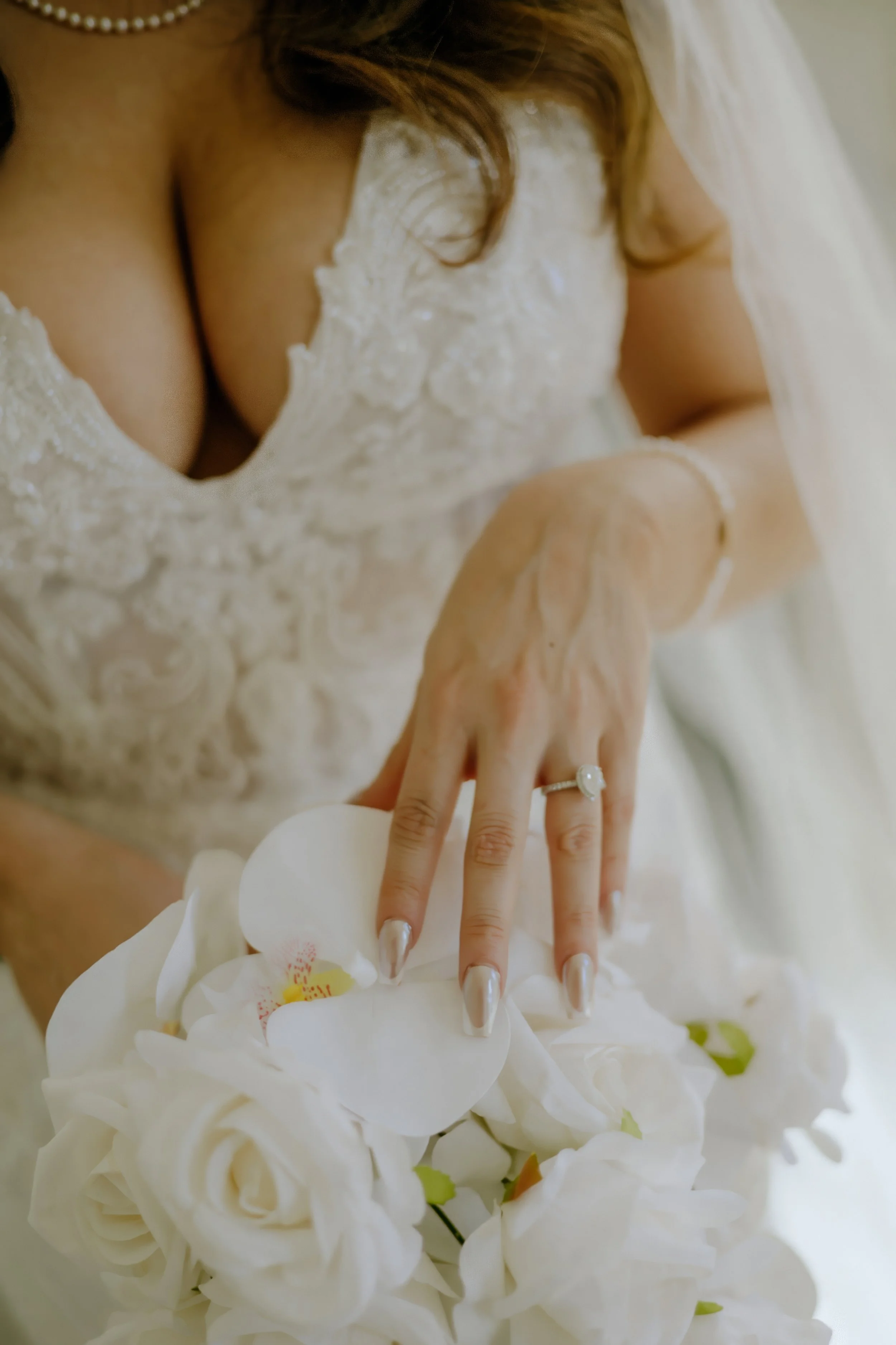Houston & Texas Family, Couples, Newborn, Maternity, Bridal Photography – Bride holding bouquet near ornate gold chandelier, Houston studio.