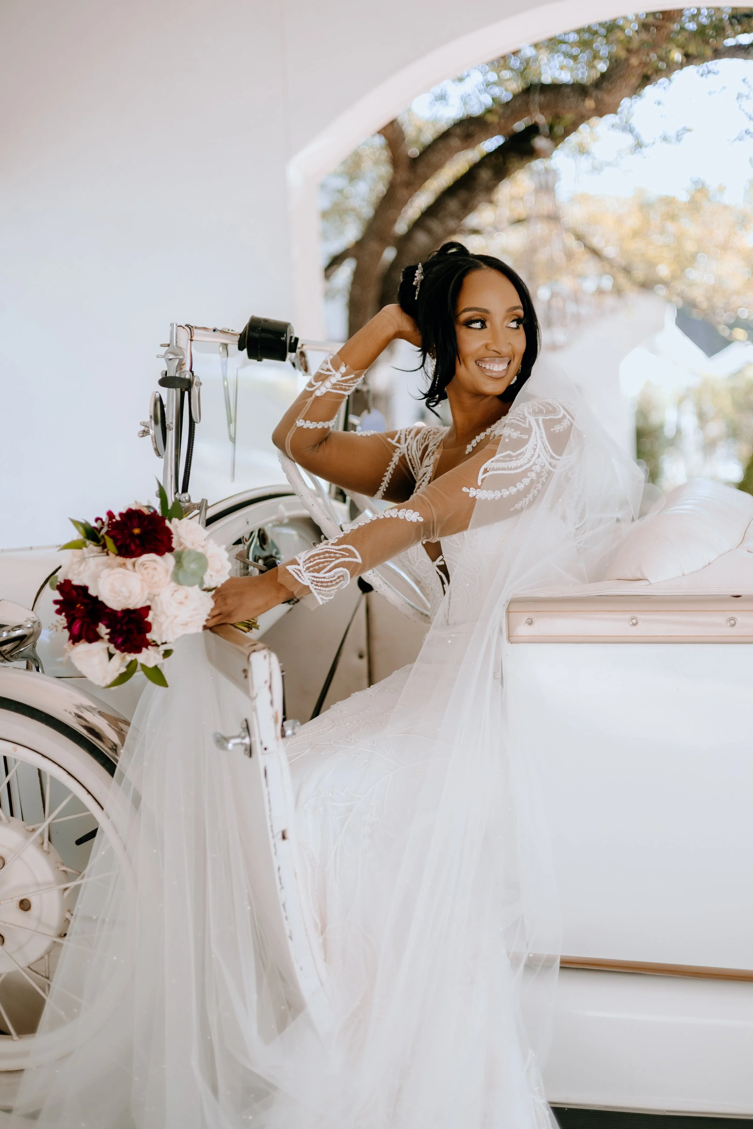 Houston & Texas Family, Couples, Newborn, Maternity, Bridal Photography – Bride posing with veil near vintage car, The Woodlands TX.