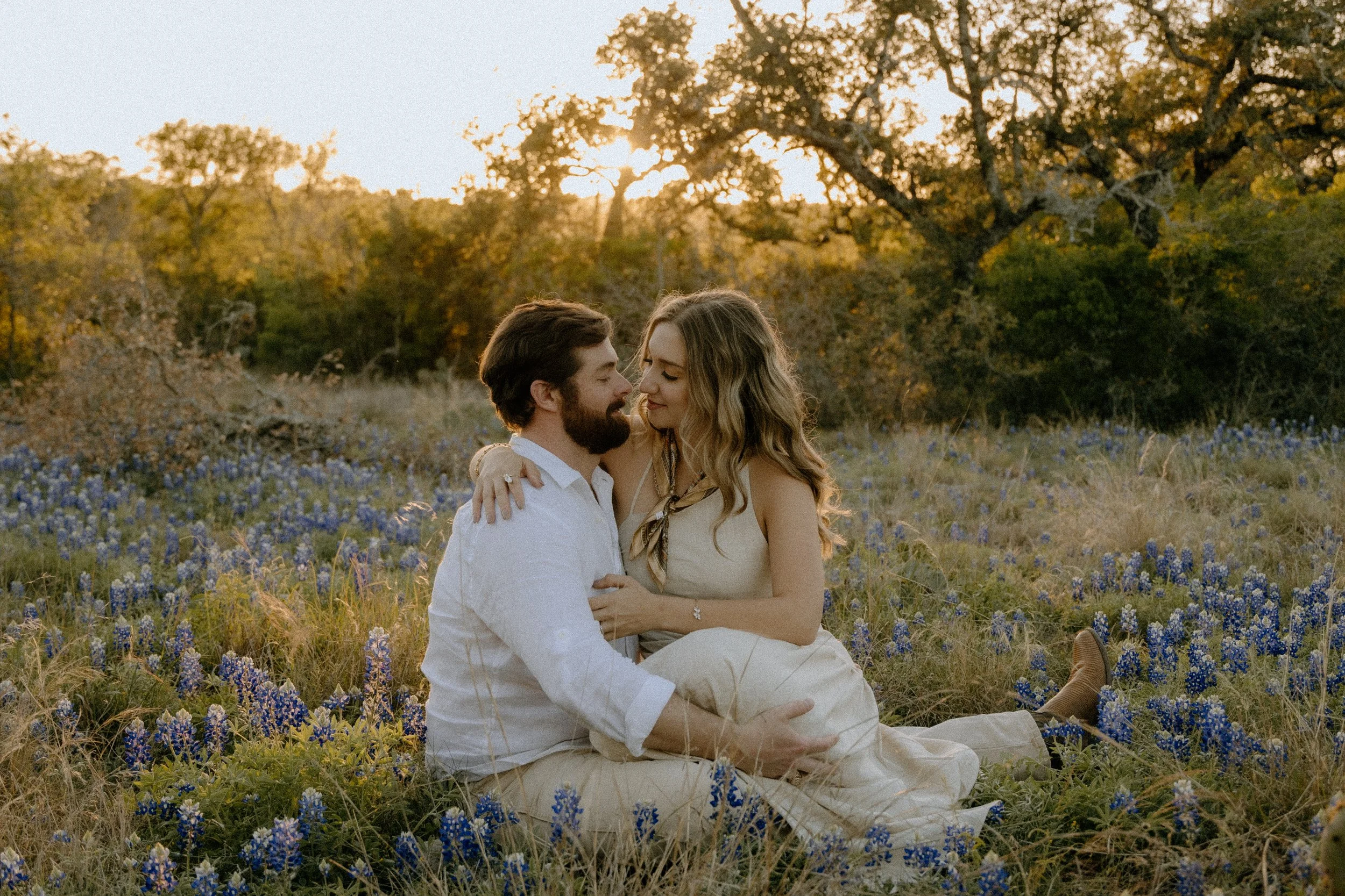 Houston & Texas Family, Couples, Newborn, Maternity, Bridal Photography – Playful couple with guitar in Austin TX wildflower meadow.