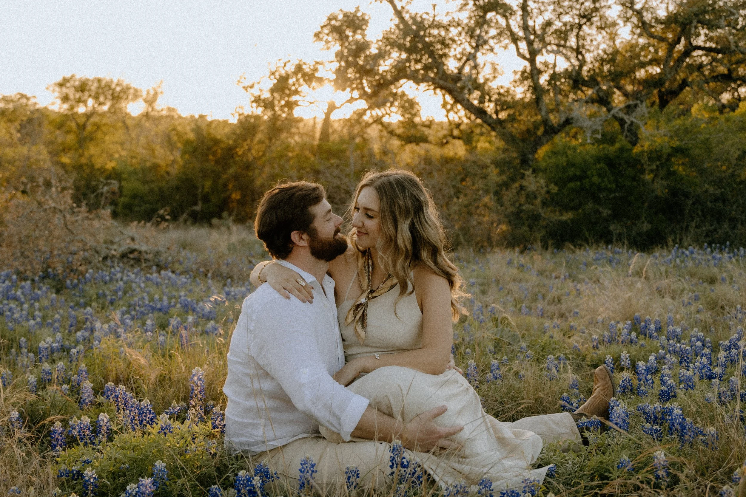 Houston & Texas Family, Couples, Newborn, Maternity, Bridal Photography – Sunset light glowing on couple in Austin TX wildflower field.