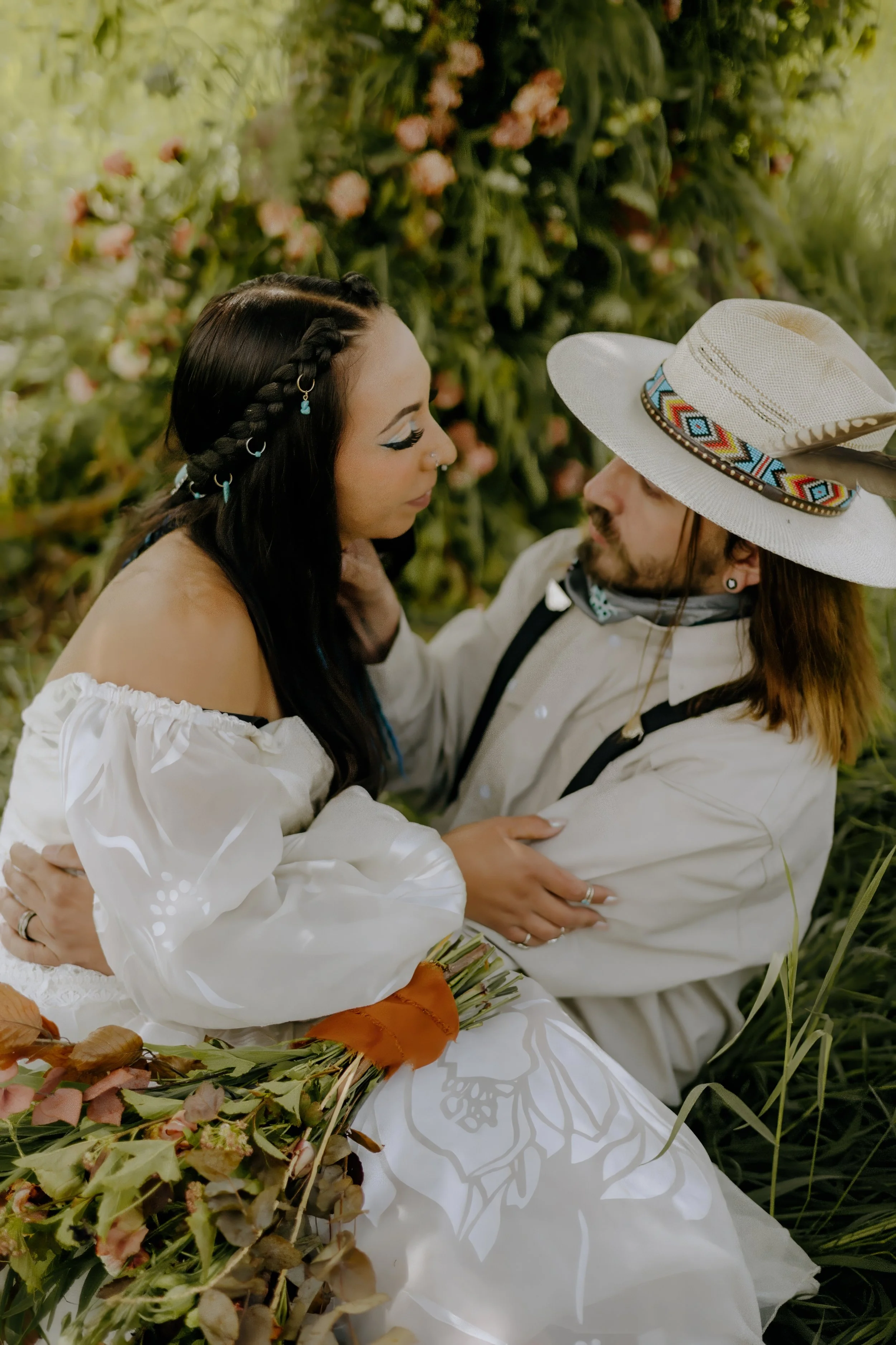 Houston & Texas Wedding & Elopement Photography – Couple framed by fence and wild horses at Diamond Cross Ranch.