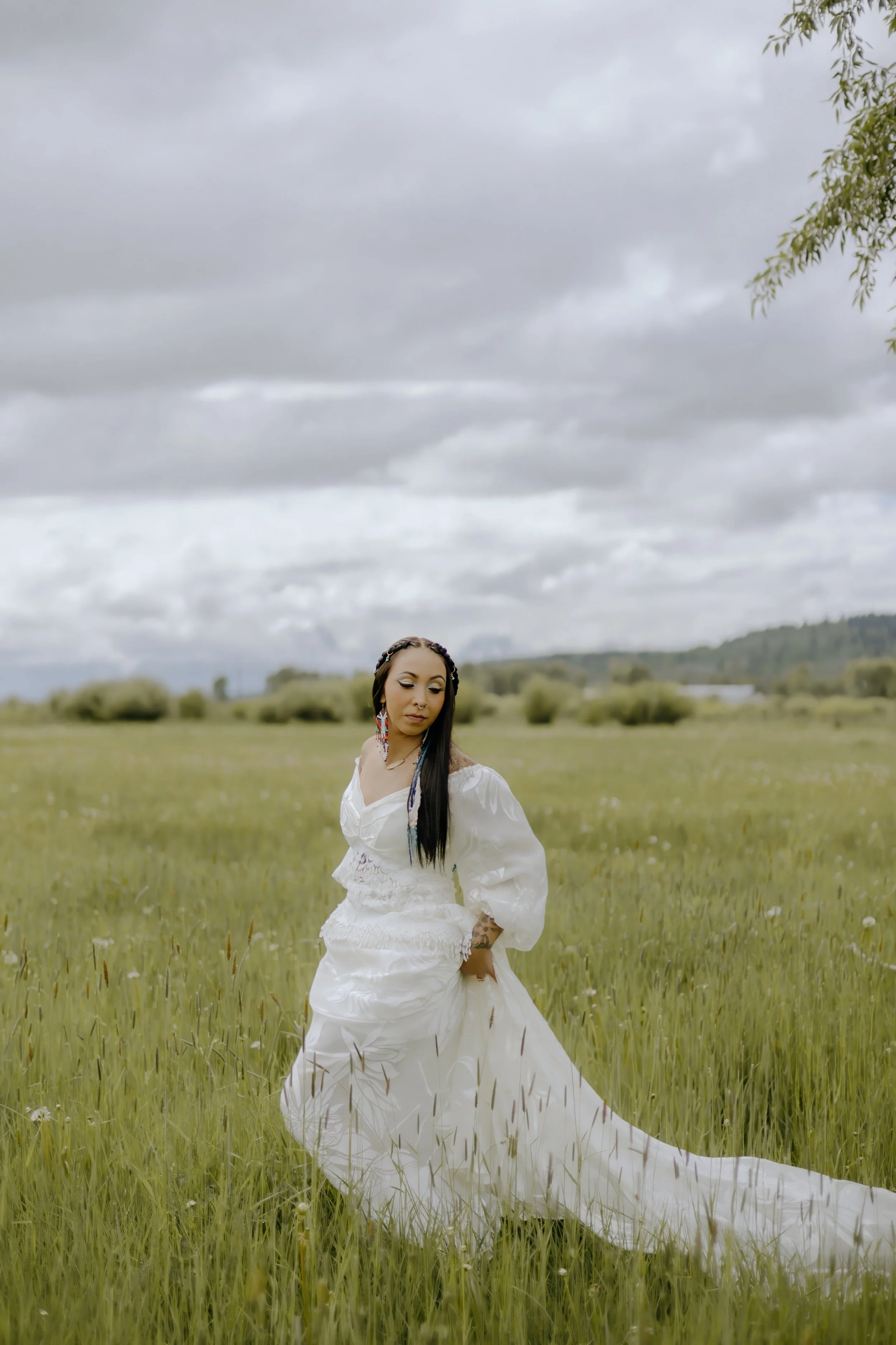 Houston & Texas Wedding & Elopement Photography – Bride looking off into distance in open field at Diamond Cross Ranch.