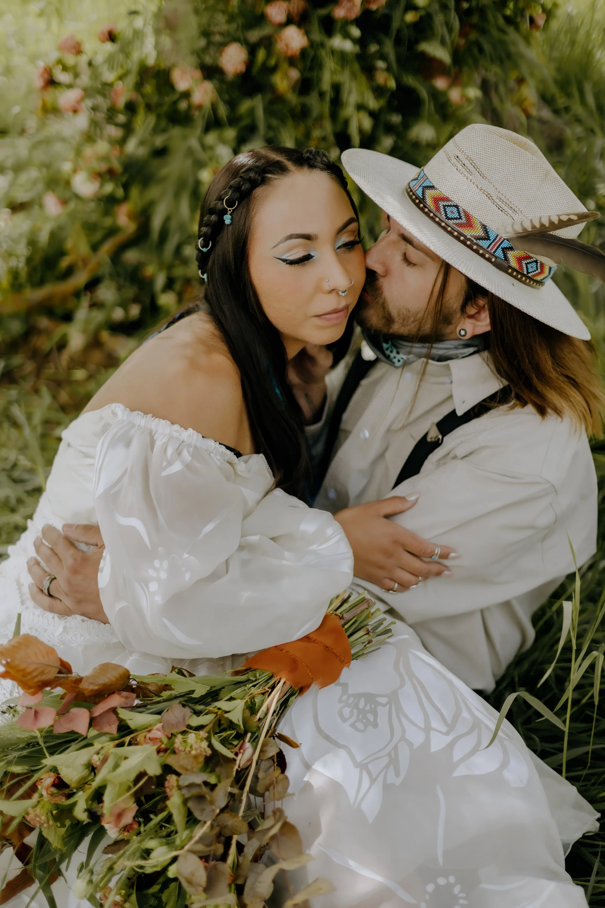 Houston & Texas Wedding & Elopement Photography – Couple seated and kissing under willow tree at Diamond Cross Ranch.