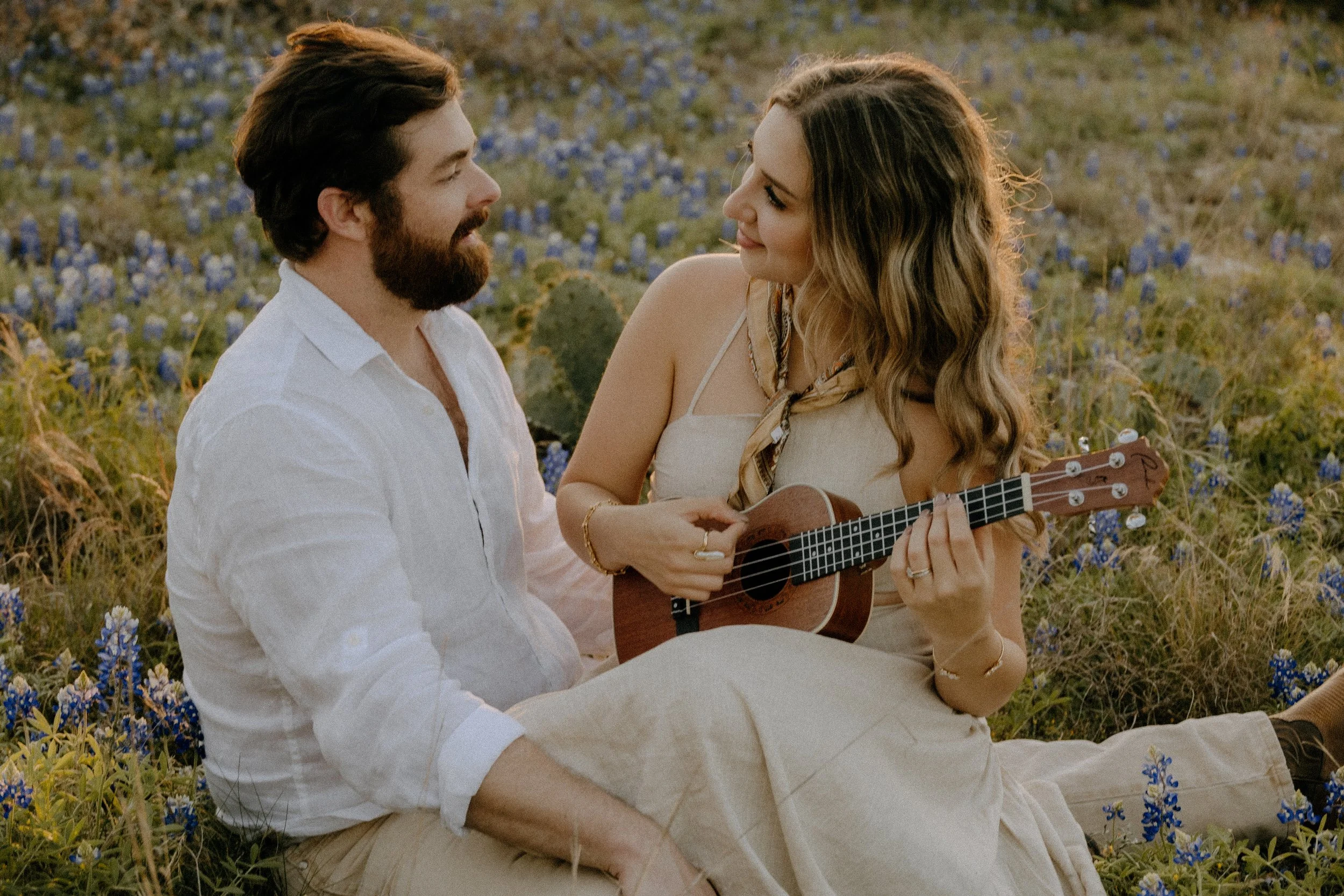 Houston & Texas Family, Couples, Newborn, Maternity, Bridal Photography – Couple seated close, guitar detail in Austin TX portraits.