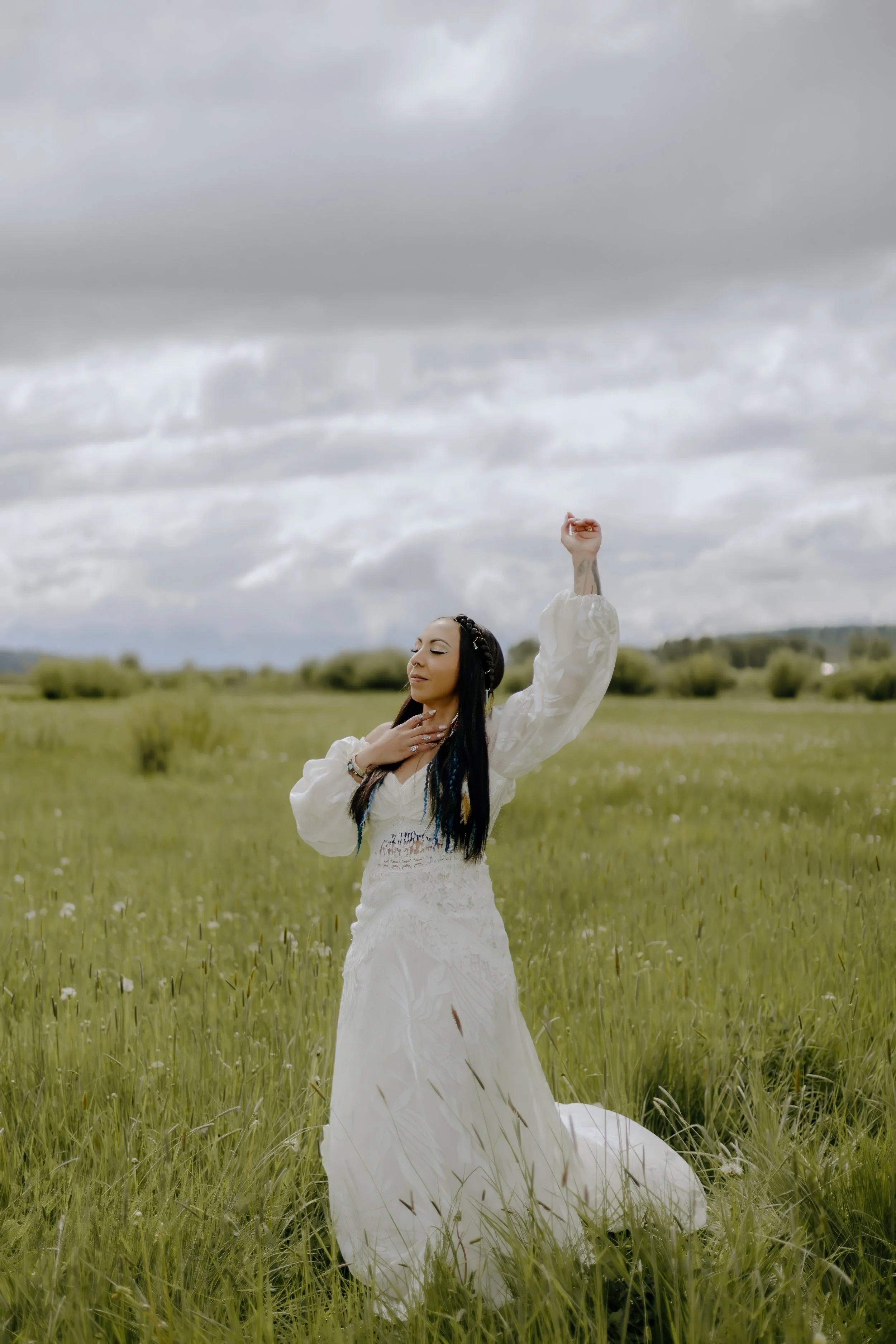 Houston & Texas Wedding & Elopement Photography – Bride with veil flowing over grassy field at Diamond Cross Ranch elopement.