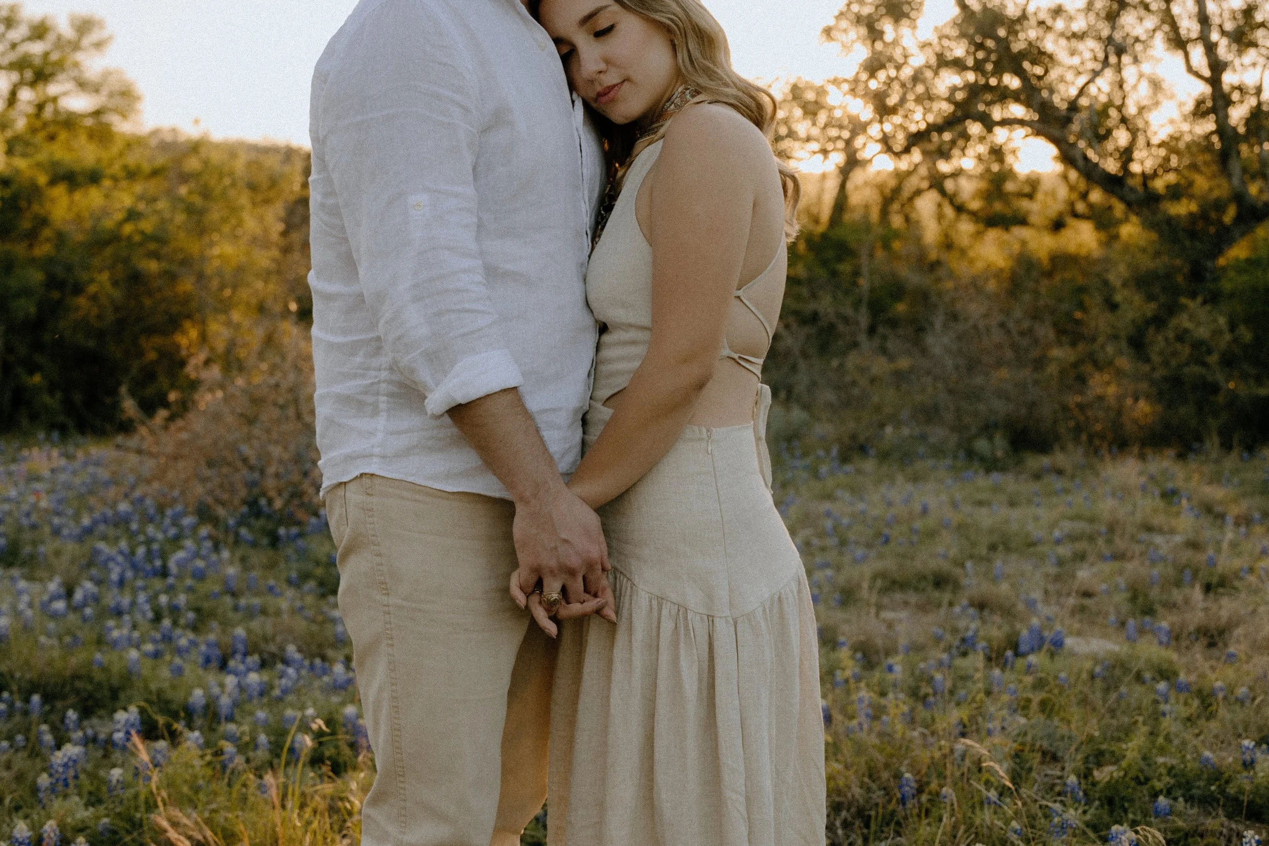 Houston & Texas Family, Couples, Newborn, Maternity, Bridal Photography – Candid embrace during Austin TX couple’s sunset portraits.